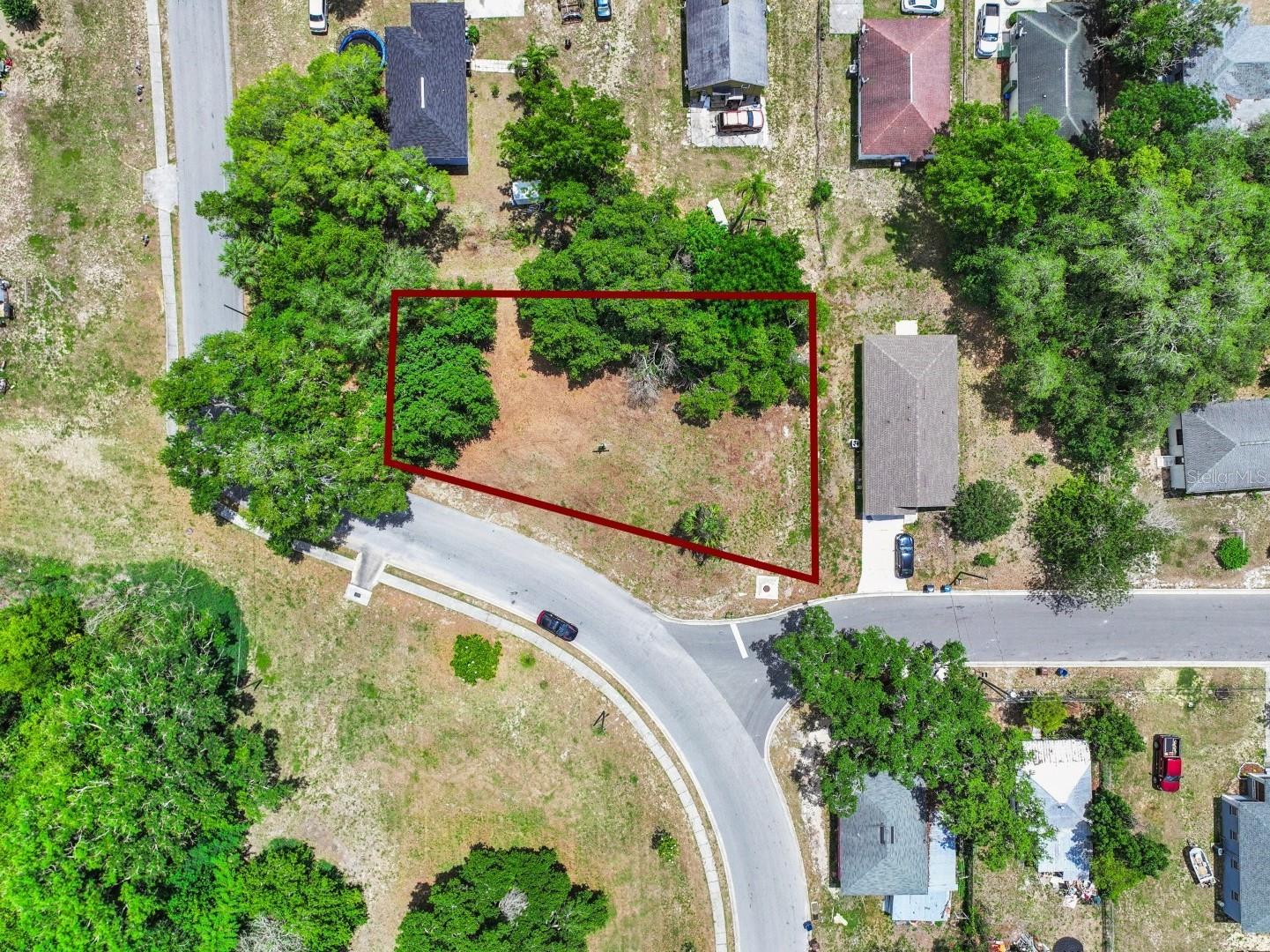 An exceptional real estate opportunity awaits with these two combined lots totaling 0.30 acres ,with access to public water & sewer, offering the perfect canvas to build your dream home with no HOA restrictions to limit your vision. One single-family residence is permitted on each individual lot, creating an incredible opportunity for multi-generational living, investment potential, or added flexibility for future plans. Alternatively, the parcels may potentially be combined into one larger homesite for additional privacy, yard space, and expanded building possibilities. The zoning also allows for additional structures such as a detached garage or workshop, making this an ideal setup for those needing extra storage or workspace. Bring your boats, trailers, RVs, and other toys, with parking permitted in the side and rear yard areas, as per Haines City’s rules and regulations. Offering a prime Central Florida location, this property places you just minutes from premium local attractions, including the award-winning Southern Dunes Golf Course, a highly rated championship course known for its 100-foot elevation changes and TopTracer driving bays. For family fun and community events, the nearby Lake Eva Aquatic Center features a fantastic public water park complete with a competition pool, splash pad, and zero-depth entry lagoon. Conveniently located off Highway 27, and a short drive to Posner Park, where shopping, dining, and entertainment await at a vibrant 80-acre retail hub with major stores including Target, PetSmart, Dick’s Sporting Goods, Best Buy, Hobby Lobby, HomeGoods, Michaels, Books-A-Million, BJ’s Wholesale Club, Cinépolis IMAX Theater, and so much more. Or hop onto I-4 to enjoy everything Central Florida has to offer, including being less then 30 miles from Disney’s Magic Kingdom. Build your home on land that combines location, value, and opportunity all in one. Don’t miss this rare opportunity to secure a spacious,  property that perfectly balances flexibility, convenience, and endless potential in the heart of Central Florida.