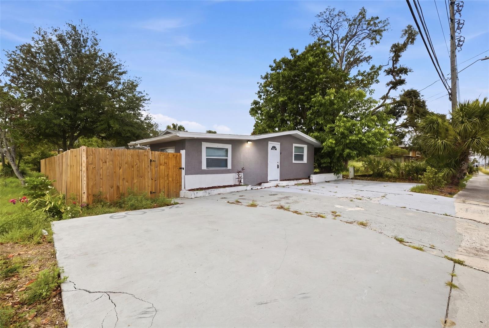 **Seller is offering buyer $5,000 credit at closing!!!  Welcome to 605 S Disston Ave — a versatile multi-unit property in the heart of Tarpon Springs offering comfort, flexibility, and income potential. This well-maintained home features a spacious 3-bedroom main residence with updated flooring, bright living spaces, and a functional layout ideal for everyday living. The property also includes a separate mother-in-law suite, perfect for extended family, guests, or rental use.
Situated on a corner lot, this residence provides ample parking, privacy, and outdoor space. With no HOA, you have the freedom to use the property as you choose — live in one unit and rent the other, create a multi-generational setup, or operate as an investment property. Located minutes from downtown Tarpon Springs, the Sponge Docks, parks, beaches, and top local dining, this home offers both convenience and long-term value.
Whether you’re seeking a primary residence with added flexibility or a property with built-in income potential, 605 S Disston Ave delivers a rare opportunity in a highly desirable location.