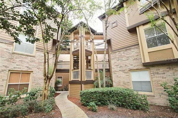 Beautifully renovated second-floor condo featuring 2 bedrooms plus a spacious bonus room in the highly desirable Windsor at Sabal Walk community of Sabal Park in the heart of Longwood. Surrounded by mature oak trees draped with Spanish moss, this community offers a peaceful setting just minutes from Wekiwa Springs State Park, Wekiva Island, shopping, restaurants, and convenient access to I-4 and the Express Lanes.This home has been completely renovated and features luxury vinyl flooring throughout. Upon entry, you'll find a large bonus room with floor-to-ceiling windows that fill the space with natural light, making it ideal for a home office, den, or guest room (no closet).The formal dining area overlooks the beautifully updated kitchen, which features white quartz countertops, white cabinetry, new stainless steel appliances, and a breakfast bar with seating. The secondary bedroom is located just off the kitchen and offers direct access to the full guest bathroom, which also has a separate entrance from the hallway for guests. The full-size laundry room, complete with washer and dryer, is conveniently located within the guest bathroom.Step down into the spacious living room, where sliding glass doors open to a screened porch overlooking the community pond. The porch also includes a private storage closet.The split-bedroom floor plan provides added privacy, with the primary suite located off the living room. It features a large walk-in closet and an en-suite bathroom with dual vanities.Water is included in the rent.