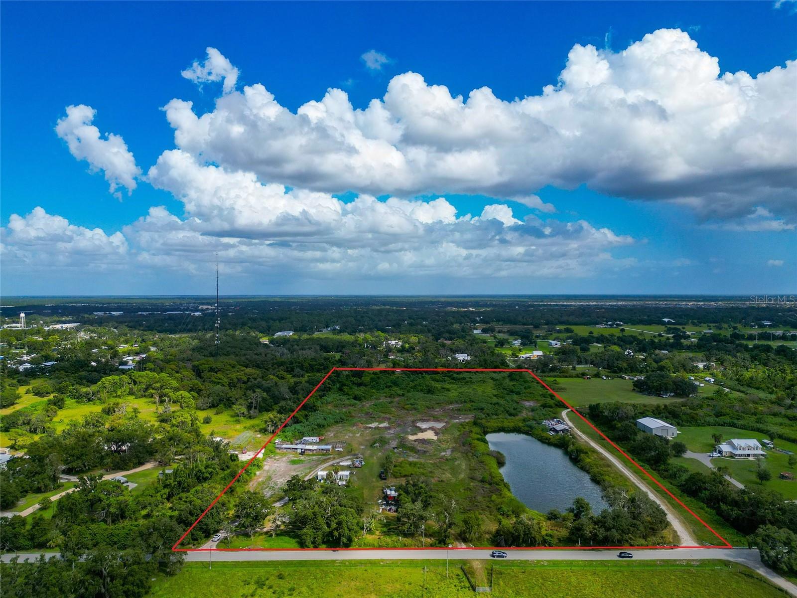 19.96 ACRES MINUTES FROM I-75 AND FRUITVILLE ROAD!!! Two individual parcels that are being sold together. This is a RARE OPPORTUNITY to purchase versatile land in the heart of rapidly developing Sarasota just South of Lakewood Ranch! OUE Zoning, this property offers an opportunity for future development. Survey available. Soil tests done. Bring your Builder and your imagination--or hold for long term investment. This property offers great opportunities for development thanks to its favorable OUE (Open Use Estate) zoning. No HOA and no Deed Restrictions. This rare property offers stunning opportunity to someone desiring space and privacy, without sacrificing the convenience of being right in town. The land could potentially be divided into a number of estate sized properties or further into a neighborhood if desired.  Convenience meets tranquility with this property’s prime location. Situated just under 5 minutes from the highway, you’ll enjoy seamless access to everything Sarasota has. The vibrant University Town Center (UTC) area is only 15 minutes away, offering over 250 stores, restaurants, and entertainment options. UTC is also home to Nathan Benderson Park, a hub for outdoor activities and international rowing events, making it a destination for shopping, recreation, and entertainment. Additionally, the property is just 20 minutes from the cultural and culinary delights of downtown Sarasota, where you’ll find theaters, galleries, waterfront parks, and award-winning restaurants.