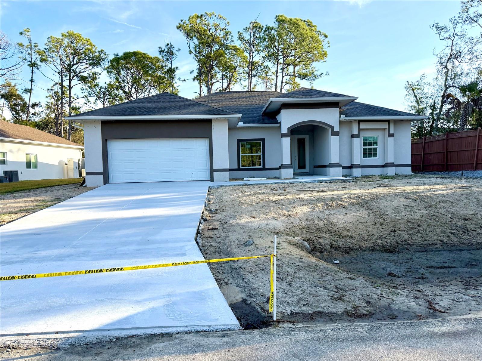 Under Construction.  Under Construction. Completion is expected in May 2026. These photos are from the actual home being built. New construction home that is a split floor plan with 3 bedrooms, 2 baths with a large den. The great room is expansive with coffered ceilings with large pocketing sliding glass doors that open up to the lanai. The kitchen has large island with seating room, quality all wood cabinets and quartz countertops. The home meets all new wind codes, built with strong steel exterior, stucco finishing, hurricane rated windows and an engineered roof and steel trust system. The Location of home is near I 75. There are several upgrades in this home separating it from other builders. The large den that is perfect for the home office or a media room. The second bath is pool ready and plumbing access on the other side of the wall if you decide to put in an outdoor kitchen. Our dining room is located at the rear of the home to enjoy the view of the back yard and natural setting. The master bedroom has his and her walk-in closets, large sliding glass doors which open up to the lanai and a sitting area with a nice view of the backyard. The home has 2 bathrooms with wood cabinetry. The master bathroom is oversized and has a walk-in shower, a built-in tub, separate his and her sinks, private toilet and a window for natural lighting. We have a large laundry room with plenty of storage and a pantry. The home meets all new wind codes, built with concrete block, stucco finishing, hurricane rated energy windows and an engineered roof and trust system rated for up to 160 mph winds. There is a 1 year standard builder warranty included.