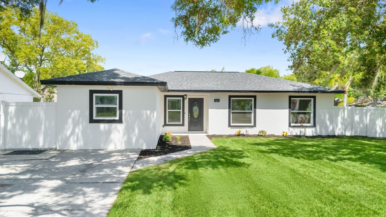 Welcome home to this BEAUTIFULLY UPDATED 4-bedroom, 2-bath POOL HOME situated on a spacious corner lot of nearly a quarter acre in Brandon! Featuring a BRAND NEW ROOF, fresh interior and exterior paint, and luxury vinyl plank (LVP) flooring throughout, this home is completely move-in ready! Designed to impress, the stunning kitchen features crisp white 42-inch shaker cabinetry with elegant crown molding, stainless steel appliances, a designer tile backsplash, LED lighting, and ample cabinet space. This thoughtfully designed lay out flows seamlessly into the dining and living areas, creating the perfect space for entertaining and everyday living. The open floor plan offers a bright and inviting atmosphere with spacious living and dining areas that are perfect for gathering with family and friends. Retreat to the spacious primary suite featuring a beautifully remodeled en-suite bathroom with a gorgeous walk-in tiled shower. Both bathrooms have been tastefully updated with stylish tile, modern vanities, and contemporary finishes. Step outside to your own private backyard oasis complete with a sparkling pool, paver patio, and fully fenced yard—ideal for relaxing, entertaining, or enjoying Florida's year-round sunshine. Situated on a desirable corner lot of nearly a quarter acre, this beautifully updated home offers modern finishes, functional living spaces, and an exceptional outdoor retreat. Conveniently located with easy access to I-75, this home offers a quick commute while being just minutes from shopping, dining, entertainment, and everyday conveniences. Enjoy the perfect combination of comfort, style, and an unbeatable location! Schedule your private showing today!