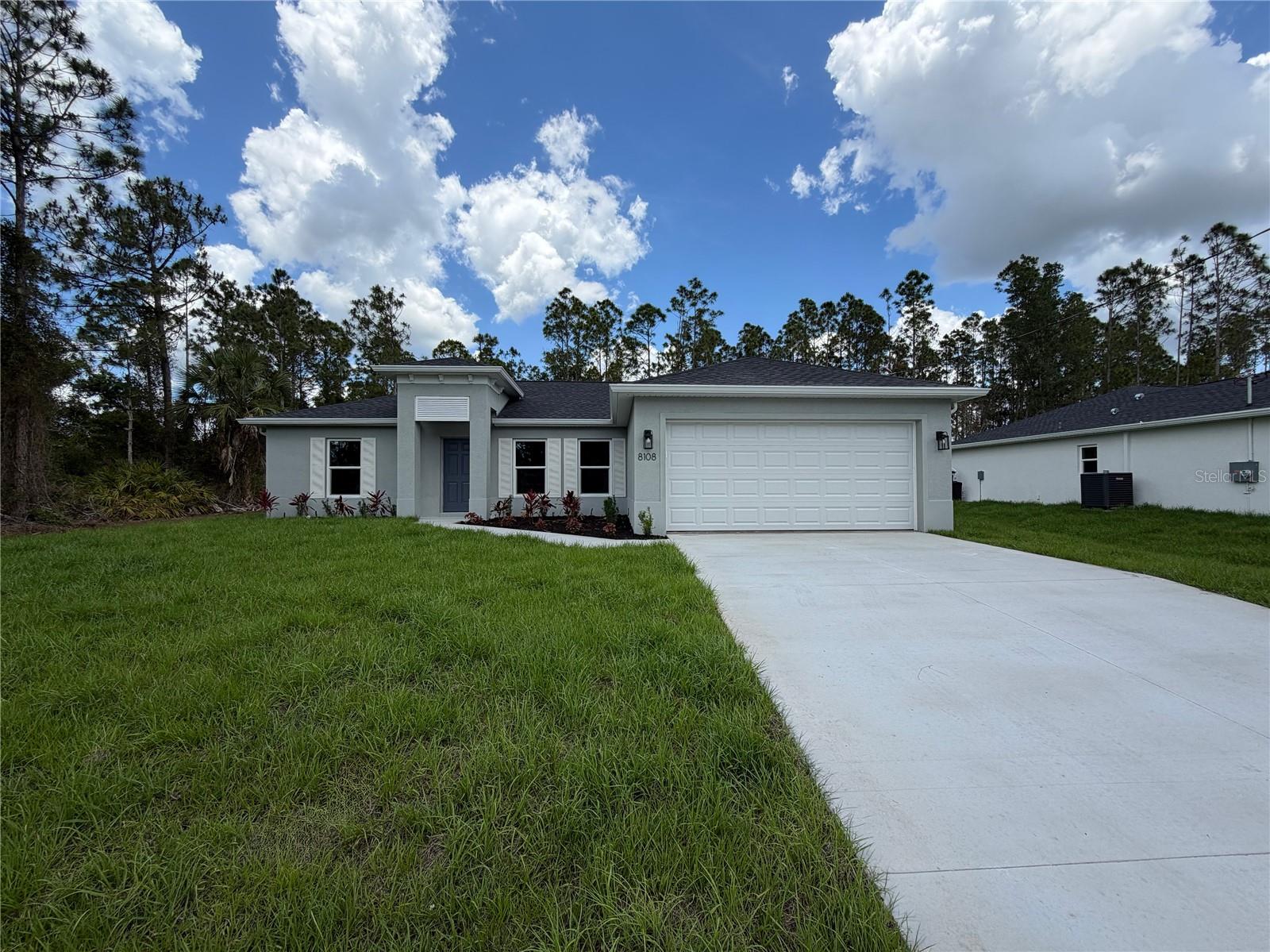 Under contract-accepting backup offers. One or more photo(s) has been virtually staged. BEAUTIFUL NEW CONSTRUCTION HOME - AVAILABLE NOW!

Why settle for a basic "builder grade" home when you can have it all included? This stunning home offers a level of upgrades rarely seen at this price point. Featuring an open, split floor plan with vaulted ceilings, this home is built for both style and long-term savings.

PREMIUM FEATURES INCLUDED: This home is fully equipped with PGT double-pane Hurricane Impact windows and sliding doors, meaning NO shutters are ever needed. You will find 50-year-rated porcelain tile flooring throughout the entire home, including the showers. The chef-inspired kitchen features 36-inch upper cabinets with soft-close drawers and doors, premium granite or quartz countertops, and quality stainless steel appliances.

BUILT FOR SAVINGS AND DURABILITY: Designed to keep your insurance, maintenance, and utility costs at a minimum, this home includes an energy-efficient HVAC system, a 3- or 4-zone sprinkler system and a 30-year shingle roof. The exterior comes fully sodded and professionally landscaped, complete with gutters around the entire perimeter and a fully screened-in lanai for year-round Florida living.

PEACE OF MIND: Move in with confidence knowing your investment is protected by extensive warranties, including a 10-year structural warranty and a 10-year HVAC warranty.

FINANCING BONUS: Our preferred lender is currently offering up to $1,500 in closing cost assistance!