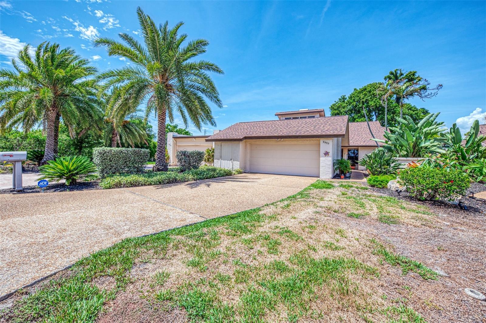 Looking for a unique place to call home! Come discover this exquisite 3 bedroom, 2 bath Villa with 2 car garage on the 17th Tee of the World Renown IMG Golf Course! This is a rare opportunity to own in the Fairway Townhouses & Villas in El Conquistador Community - Where golf course views, space and location come together. It is a rare find too fine a true three-bedroom villa with (newer roof 2023) that is light, bright and spacious at 2,328 sq.ft. under air. Open Kitchen with newer stainless-steel appliances and open to double side fireplace with high vaulted ceilings. Spanish tile and luxury vinyl flooring thru-out home. Primary bedroom is open to Florida Room overlooking the 17th Tee! IMG is a prime golf course with near IMG Academy and IMG Golf and Country Club. Home offers formal dining room, great room and split guest bedrooms and guest bath! The Fairways is the perfect location nestled in Bradenton, close to shopping, dining, gulf beaches, hospitals airports and is waiting for you to call this place your new HOME! Home is sold Furnished! No CDD! Insurance is included in Condo Dues!