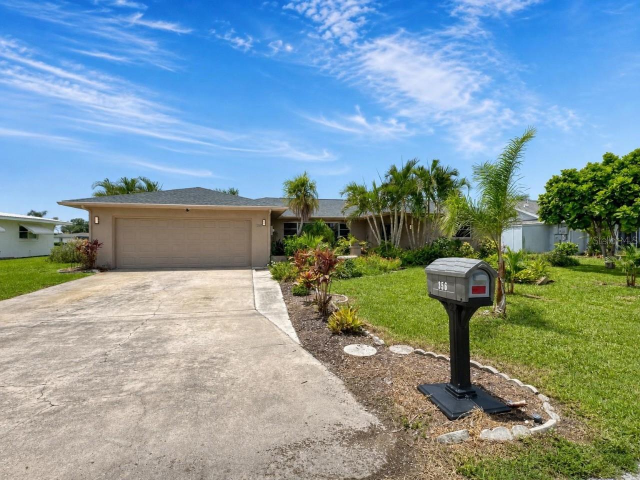 Wake up every morning to peaceful water views from one of the most desirable homes in Venice Gardens. Perfectly positioned on a scenic waterfront lot, this spacious 3-bedroom, 3-bathroom home offers nearly 2,000 square feet of thoughtfully designed living space, a highly sought-after split floor plan, and one of the biggest advantages of all—NO HOA fees, giving you the freedom to truly enjoy your property without extra restrictions or monthly dues.  From the moment you step inside, you'll appreciate the open, inviting layout that effortlessly balances comfort and functionality. The private primary suite is tucked away from the guest bedrooms, creating the perfect retreat, while three full bathrooms make everyday living and hosting family or friends remarkably convenient. Whether you're working from home, welcoming overnight guests, or simply looking for room to spread out, this versatile floor plan adapts to your lifestyle.  The true highlight awaits outside. An expansive screened lanai showcases beautiful, uninterrupted water views that instantly create a sense of peace and relaxation. Imagine starting your mornings with coffee overlooking the water, enjoying dinner as the sun reflects across the lake, or entertaining friends in a setting they'll never want to leave. Just beyond the lanai, a spacious patio provides the perfect space for grilling, gardening, or simply soaking up the Florida sunshine. A two-car garage adds even more practicality with plenty of room for vehicles, storage, or hobbies.  Location only makes this home even more desirable. Situated outside of a flood zone, you're less than 10 minutes from Venice's world-famous Gulf beaches, charming downtown shops and restaurants, and quick access to I-75, making travel throughout Southwest Florida incredibly convenient. Everyday essentials, golf courses, parks, medical facilities, and top-rated schools are all just minutes away, allowing you to enjoy the perfect balance of convenience and peaceful neighborhood living.  Finding a home that combines waterfront views, nearly 2,000 square feet, three full bathrooms, a split-bedroom design, a two-car garage, NO HOA, and a location this close to the beach is exceptionally rare. If you've been waiting for a home that offers both the Florida lifestyle and lasting value, this is your opportunity.    Schedule your private showing today and experience why 356 Peppertree Road is the home buyers won't want to miss.
