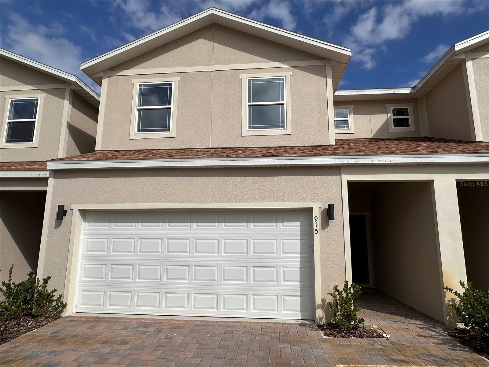 Welcome to your dream townhome in the picturesque city of Clermont, Florida! Nestled in the sought after community, Lakefront Village, this stunning property offers the perfect blend of comfort, convenience, and breathtaking lake views. This *3 BED / 2 FULL BATH / 1 HALF BATH TOWNHOME is located near the intersection of US Highway 27 and FL-50, with convenient access to Florida’s Turnpike and FL-429. Walk in through the front door and be amazed by this spacious and filled with natural light home, with remarkable views to Jack's Lake. The main level features sliding doors to the balcony, perfect for relaxing and enjoying the view. The KITCHEN features GRANITE COUNTERTOPS, 36" white UPPER CABINETRY, STAINLESS STEEL APPLIANCES such as MICROWAVE, DISHWASHER, RANGE, REFRIGERATOR and an ISLAND. Going upstairs, the MASTER SUITE features WALK-IN CLOSET, DUAL GRANITE VANITY and stand up shower with enclosure. BEDROOMS 2 and 3 share the second full bathroom and LAUNDRY is conveniently located on the second floor. The lower level consists in an oversized open space (not under AC). The open lower level gives access to the backyard, with views and walking distance to the lake. This home also offers a 2 CAR GARAGE with paved driveway. The community features sidewalks, views and access to Jack's Lake.