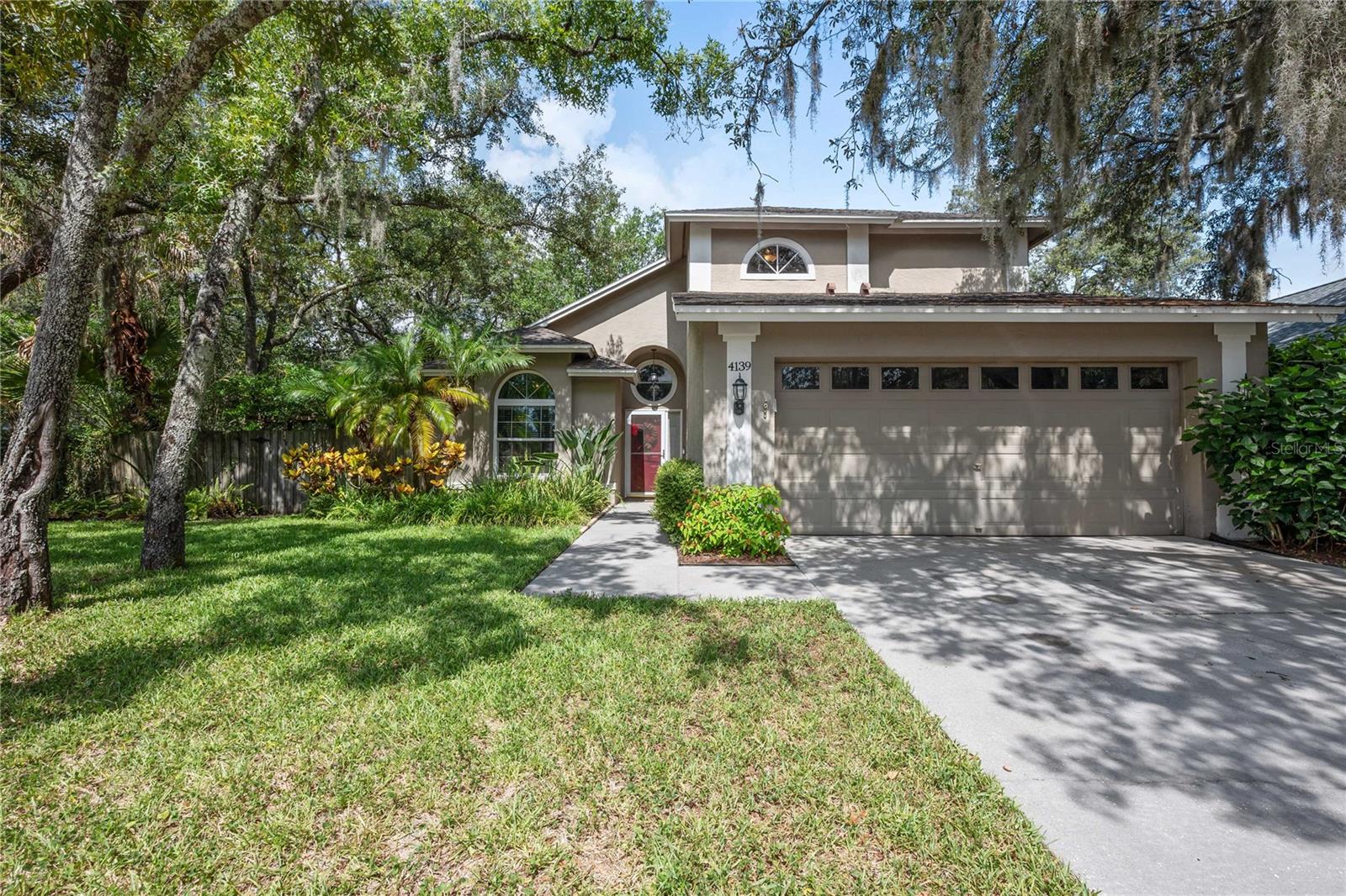 Beautifully maintained and thoughtfully updated, this home features a NEW ROOF (July 2026), NEW A/C (January 2026), NEW plumbing (June 2026), and a newer hot water heater (2021), giving you peace of mind from day one. Located in the highly desirable Bloomingdale community with no HOA and CDD Fees—known for its tree-lined streets, well-kept homes, top-rated schools, parks, golf, and unbeatable convenience—you’ll enjoy quick access to shopping, dining, and major highways for an easy commute to Tampa, Brandon, and Riverview. Situated on a large corner lot, the curb appeal is undeniable and the warmth inside is immediate. Vaulted ceilings and rich hardwood floors set the tone as the immaculate open layout connects the kitchen, dining room, and great room—ideal for entertaining. The kitchen offers a breakfast bar and a charming bistro nook framed by natural light, with a convenient half bath nearby. The first-floor primary suite accommodates a king bed and includes double sinks, a vanity area, a separate tub and shower, and a walk-in closet. Upstairs, a versatile bonus room with built-in shelving overlooks the main living area, perfect for an office or flex space, while the secondary bedrooms share a nicely sized full bath. Outside, enjoy a large, shaded, fully fenced backyard with mature landscaping, a screened patio, and a relaxing  private retreat. The two-car garage includes a mud sink and ample shelving, and an additional utility shed provides even more storage. Lovingly cared for and move-in ready, this home is prepared for its next chapter—don’t miss your chance to make it yours.
