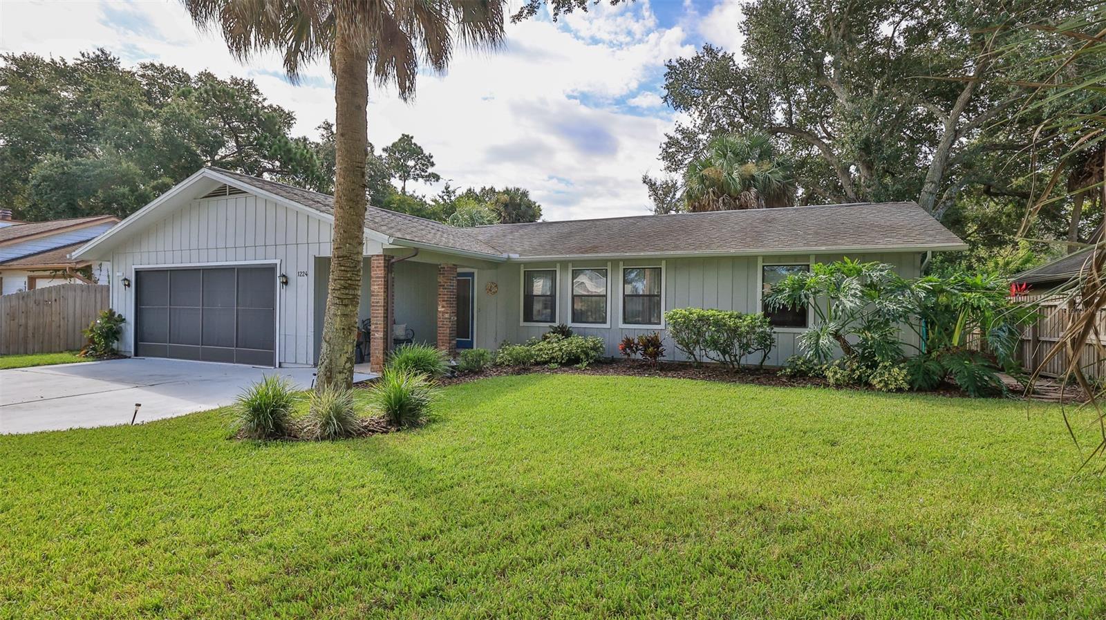 Charm in every corner of this 2 bedroom, 2 bath home.  Large lot backs up to a tidal canal which runs into Turnbull Bay. Lushly and beautifully landscaped around the entire house with touches of quaint rock and mulched gardens. Enjoy coffee on the large screened in back porch while getting back to nature. Porch opens to the dining and living area.  Owner has a partitioned room with an outside entrance and permitted Air BnB. Oversized garage with a master which has its own private side entrance. Close to two golf courses, the beaches, restaurants, and the famed Canal Street. This is the one! Don't just dream it, live it. ;Water: City