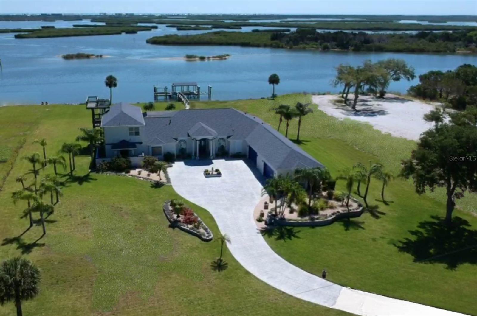 WOW! OVER 5 ACRES OF RIVERFRONT! THIS ESTATE IS TRULY A WATERFRONT OASIS. GRAND & MAJESTIC PROPERTY GIVES YOU NOT ONLY UNOBSTRUCTED PANORAMIC VIEWS OF THE INTRACOASTAL PLUS PLENTY OF PRIVACY. ONLY MINUTES FROM EXECUTIVE AIRPORTS, FAMOUS DAYTONA BEACH & RACE TRACK, SPACE COAST & ORLANDO ATTRACTIONS. 2 BOAT LIFTS & DEEP WATER AT THE RIVER CAN ACCOMODATE 70’+  YACHT WITH ADDITIONAL SPACE FOR OTHER WATER CRAFT.THIS CUSTOM DESIGNED RESIDENCE HAS 6 LARGE BEDROOMS, 6 FULL BATHS, LIBRARY, OFFICE,CLUB/GAME ROOM,GOURMET KITCHEN, 4 CAR OVERSIZED GARAGE INGROUND SCREENED HEATED SALTWATER POOL & SUMMER KITCHEN. OPEN FLOOR PLAN GIVES YOU SPECTACULAR VIEWS FROM EVERYWHERE IN THE HOME. PLENTY OF ROOM FOR ADDING A TENNIS COURT, GUEST HOUSE, DRIVING RANGE, OR OTHER POSSIBILITIES. GOURMET KITCHEN INCLUDES BUTLERS PANTRY, WALK IN PANTRY, TOP OF THE LINE 6 BURNER GAS WOLF RANGE, SUBZERO REFRIGERATOR, BOSCH DISHWASHER & MICROWAVE, AND OVERSIZED CENTER ISLAND. MASTER BEDROOM HAS A PRIVATE SCREENED PORCH, DRESSING AREA, 20X20 CUSTOM CLOSET, HIDDEN SAFE ROOM, REFRESHMENT CENTER, SOAKING TUB, LARGE MULTI-HEAD SHOWER & PRIVATE VIEWS OF THE RIVER. UPSTAIRS INCLUDES A CLUB/GAME ROOM WITH CUSTOM BAR, STAINLESS APPLIANCES, PRVATE BEDROOM & FULL BATH. THE 3RD FLOOR OBSERVATION TOWER & TANNING AREA OFFERS RIVER & OCEAN VIEWS. THE POWER HURRICANE SHUTTER SYSTEM, 32 CAMERA STATE OF THE ART SECURITY SYSTEM, WITH THE PRIVATE POWERED ENTRANCE GATE GIVES YOU TOTAL CONTROL OF YOUR ENVIRONMENT. RECENT UPDATES INCLUDE NEW ROOF, HOME BACKUP GENERATOR, HVAC UNITS, TANKLESS WATERHEATERS, BOAT LIFT, ADDITIONAL DOCK SPACE, AND RESURFACED WITH COMPOSITE DECKING . ;Water: City