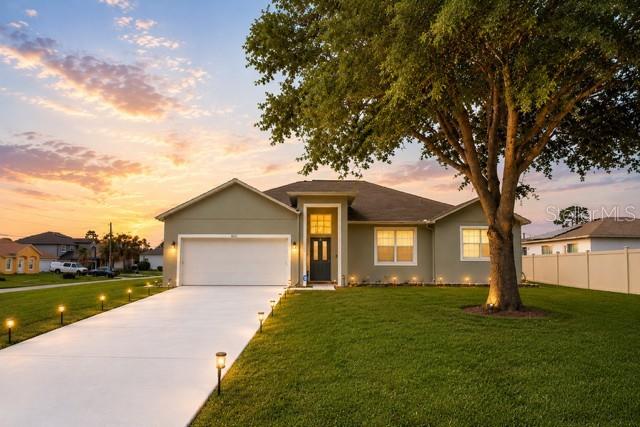 Welcome to this beautifully maintained, turnkey corner-lot residence offering exceptional pride of ownership and quality upgrades throughout. This must-see single-story family home features 3 bedrooms, 2 bathrooms, a 2-car garage, and a desirable split-bedroom floor plan with approximately 2,727 total square feet. The heart of the home is a well-appointed gourmet kitchen featuring custom white wood cabinetry, Frigidaire stainless steel appliances, granite countertops, a stylish tile backsplash, and ample workspace for both everyday living and entertaining. Elegant custom light fixtures, designer ceiling fans, upgraded faucets, and custom ceramic tile flooring create a cohesive and sophisticated feel throughout the home. The spacious primary suite serves as a private retreat and includes a luxurious en-suite bathroom with a relaxing Jacuzzi tub, a walk-in shower, a custom white vanity, and solid stone countertops. The secondary bathroom is equally well-appointed with quality finishes and updated fixtures. Additional features include quality window treatments, a dedicated laundry room equipped with high-end front-loading washer and dryer, and an inviting screened-in patio overlooking the backyard—perfect for enjoying Florida’s year-round outdoor lifestyle. Ideally situated on a premium corner lot, this move-in-ready home combines comfort, functionality, and tasteful upgrades, making it an outstanding opportunity for buyers seeking a well-cared-for property in excellent condition.