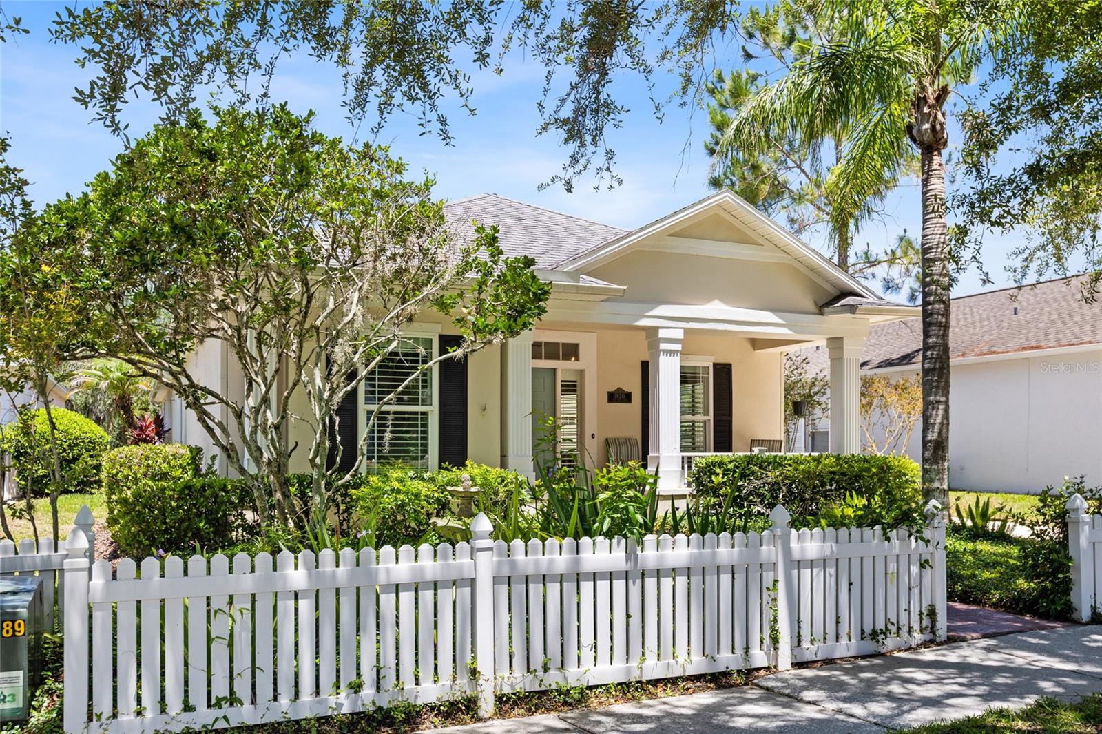 Welcome to this beautifully maintained 3-bedroom, 2-bath home with a separate den/office located in the highly desirable Sea Cove Village of Heritage Harbor, where lawn maintenance is included for easy Florida living. Perfectly positioned on a premium golf course and pond-front homesite, this home offers breathtaking views from the screened lanai and a peaceful setting to enjoy year-round.  A charming covered front porch welcomes you inside to a thoughtfully designed split-bedroom floor plan featuring rich hardwood flooring throughout the kitchen, dinette, family room, den, and primary suite. The spacious family room is highlighted by a cozy wood-burning fireplace, creating the perfect gathering space for family and friends.  The separate home office/den is ideal for remote work and includes custom built-in cabinetry and desk space. The kitchen overlooks the family room and dinette, allowing everyone to enjoy the spectacular pond and golf course views.  Retreat to the private primary suite featuring a custom-designed walk-in closet and a beautifully renovated en-suite bathroom. Additional upgrades include plantation shutters throughout and hurricane shutters for added peace of mind.  Step outside to the screened rear patio and relax while overlooking the scenic golf course fairway and tranquil pond views. This outdoor living space provides the perfect backdrop for morning coffee, evening sunsets, and entertaining guests.  Residents of Heritage Harbor enjoy access to outstanding resort-style amenities:  Championship golf course, Resort-style swimming pool with waterslide, Clubhouse, Fitness center, Tennis courts, Basketball courts, Sand volleyball court, Playground, Sports fields, Walking and biking paths, Community activities and events.  Located within the highly sought-after A-rated school district of McKitrick Elementary, Martinez Middle School, and Steinbrenner High School, this exceptional home combines comfort, convenience, and an unbeatable lifestyle.  Don't miss this rare opportunity to own a golf course and pond-front home in one of Lutz's most desirable communities.