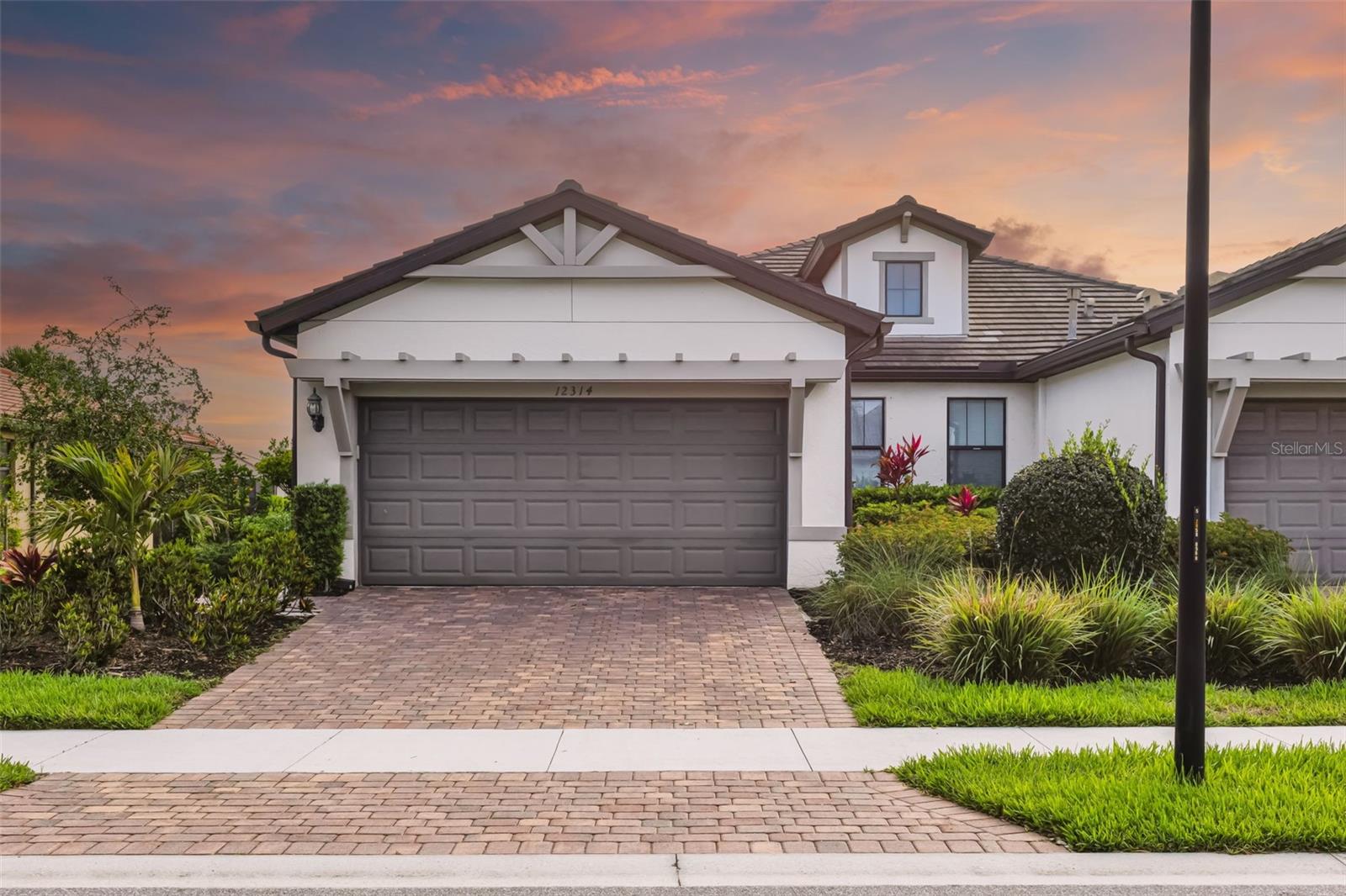 Perfectly positioned within the gated community of Hammock Preserve on Palmer Ranch, this well-priced 2-bedroom, 2-bath villa with a den/office offers a refined yet effortless approach to Florida living. Built in 2019 and thoughtfully maintained, the home features quartz countertops, stainless steel appliances, and tile flooring throughout the main living areas, complemented by plush carpeting in the bedrooms for added comfort. The open living space extends to a screened lanai overlooking a tranquil lake, creating a peaceful setting for both quiet mornings and relaxed evenings. Designed with “right-sizing” in mind, this residence delivers the ideal balance of space, style, and low-maintenance living. Residents of Hammock Preserve enjoy a true lifestyle community with resort-style amenities including tennis, a fully equipped fitness center, social spaces for gatherings and events, a pool and spa, and dedicated dog parks for both large and small pets—all offered with notably low HOA fees that enhance the overall value. Ideally located near shopping, dining, and area parks, and just a short drive to the world-renowned beaches of Siesta Key, this is an exceptional opportunity to enjoy a sophisticated, amenity-rich lifestyle in one of Sarasota’s most desirable communities.