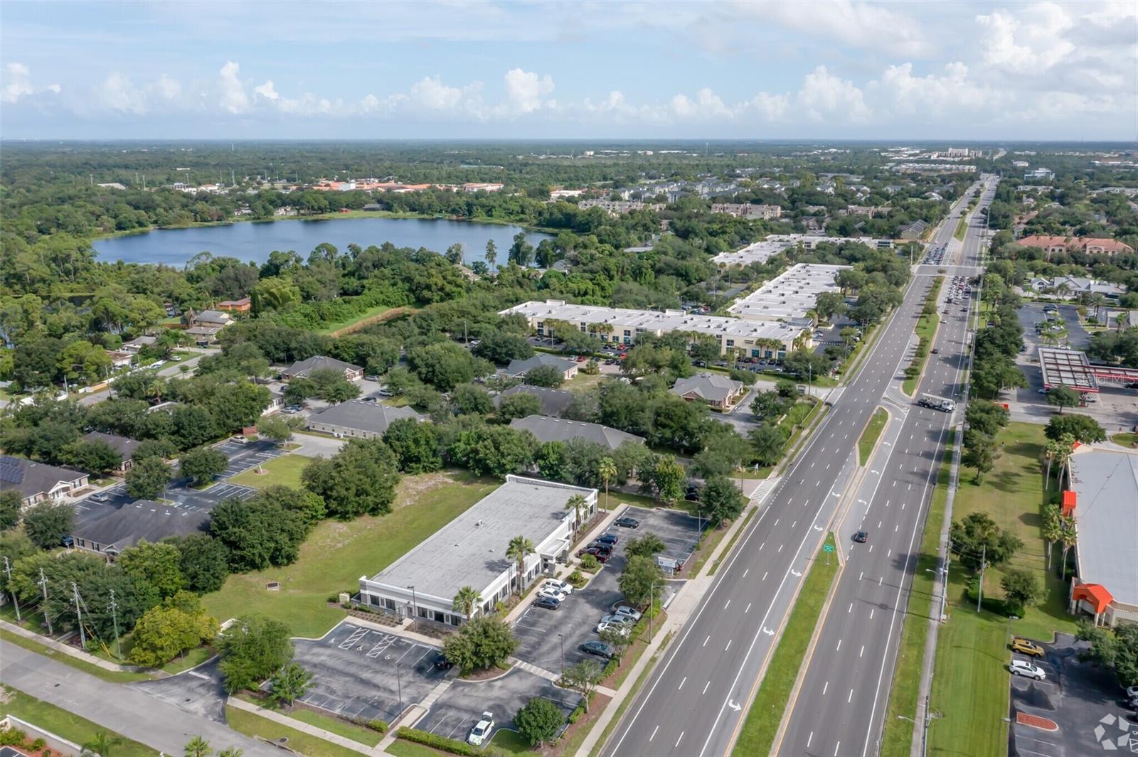 Premium standalone commercial building in the heart of East Orlando—strategically located on high-traffic Alafaya Trail with visibility to over 42,000 vehicles daily. Just 1 mile from the University of Central Florida, one of the largest universities in the country, this property offers direct access to a dynamic population of students, faculty, research professionals, and supporting businesses.

Boasting over 11,500 SF of fully renovated interior space, the building features approximately 50 individual office suites, multiple conference rooms, and well-appointed shared areas including a kitchen, coffee lounge, and reception spaces—all thoughtfully designed for productivity and comfort.

A brand-new roof and paid-off solar panels (to convey at closing) offer long-term energy efficiency and reduced operating costs. With ample on-site parking, monument signage, and strong street presence, this is a rare opportunity to own a signature asset in a thriving economic corridor.

Whether you're seeking a flagship location or an income-generating investment, this property checks every box.