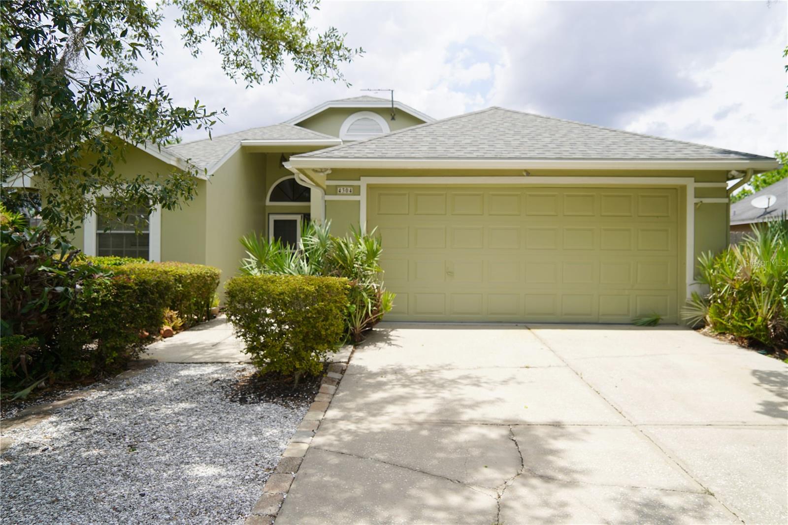 Welcome to your new home in the highly sought-after Walden Lake community! This well-maintained 3-bedroom, 2-bathroom home offers comfort, functionality, and recent updates, including a 2024 roof, fresh interior and exterior paint, and upgraded New South double-pane hurricane-grade windows throughout most of the home.

Inside, you'll find formal living and dining rooms that provide excellent space for entertaining. The kitchen overlooks the cozy family room, creating an open and inviting layout with plenty of potential for your personal updates and finishing touches. Sliding glass doors lead from the family room to a spacious covered lanai, perfect for relaxing or enjoying Florida’s beautiful weather while overlooking the landscaped backyard.

The private owner's suite is located at the rear of the home and features direct access to the lanai, a large walk-in closet, and an en-suite bathroom with dual vanities and a walk-in shower. The split-bedroom floor plan places two additional bedrooms and a full bathroom at the front of the home, offering privacy for family members or guests.

Nature enthusiasts will appreciate the backyard, which has Florida native plants and trees, creating a unique and environmentally friendly outdoor retreat affectionately known as a "Plant Nerd Paradise." Two large rain barrels are included for convenient garden watering.

Located in the desirable Walden Lake community, residents enjoy access to scenic walking trails, a dog park, playground, sporting fields, and a beautiful community lake. With major updates already completed and a fantastic location, this home is ready for its next owner. Don't miss your opportunity to make it yours—schedule your private showing today!