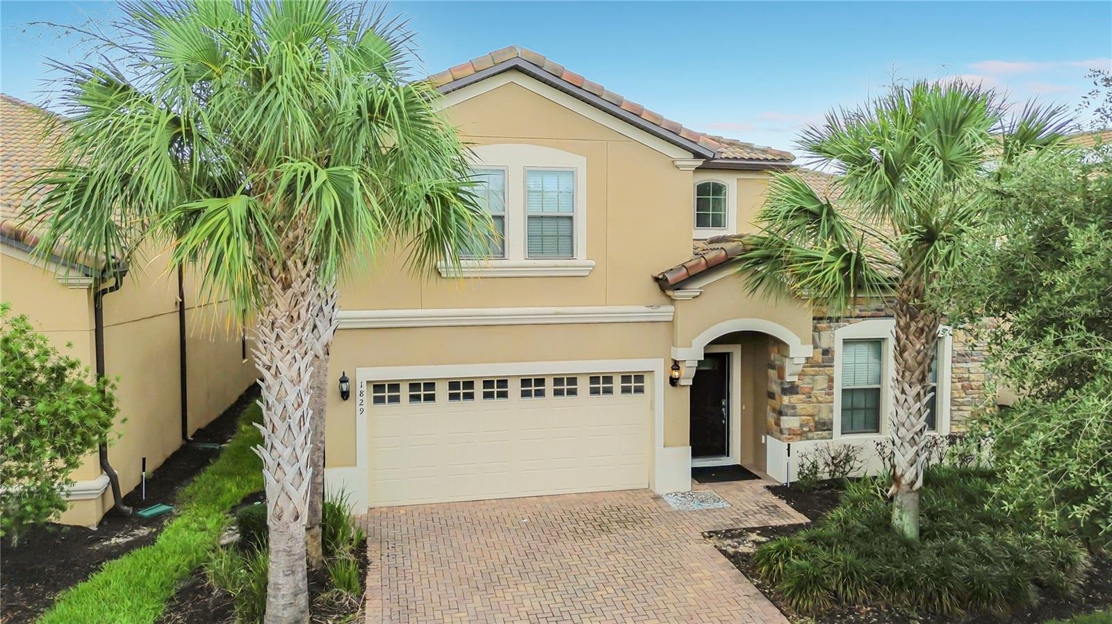 Welcome to this exceptional 8-bedroom, 6-bathroom resort home in the highly desirable Windsor at Westside community, where stunning pond views, privacy, and resort-style amenities come together to create the ultimate Central Florida retreat. Offered fully furnished and professionally equipped for short-term rentals, this turnkey property is ready for immediate enjoyment or income generation.

Designed to accommodate large families and vacation groups, the spacious floor plan features expansive gathering areas, a modern kitchen with granite countertops and stainless-steel appliances, and two primary suites conveniently located on separate floors. Thoughtfully decorated and well-maintained, the home provides a comfortable and inviting atmosphere for owners and guests alike.

Step outside to your private screened pool and spa overlooking a serene pond. With no rear neighbors and unobstructed water views, this outdoor oasis offers the perfect setting for relaxing after a day at the attractions.

Adding to the home's value and efficiency, solar panels have been installed to help offset electricity costs. The buyer will assume the existing solar lease, which is currently approximately $358/month.

Windsor at Westside is one of the area's premier vacation resort communities, featuring a spectacular clubhouse, resort-style pool, lazy river, splash zone, fitness center, arcade, sports courts, playground, and more. HOA dues include cable, internet, lawn maintenance, and valet trash service for added convenience.

Ideally located just minutes from Walt Disney World, shopping, dining, golf, and major roadways, this property offers the perfect combination of lifestyle, location, and investment potential. Whether you're searching for a vacation getaway, full-time residence, or income-producing property, this remarkable home is ready to exceed expectations.