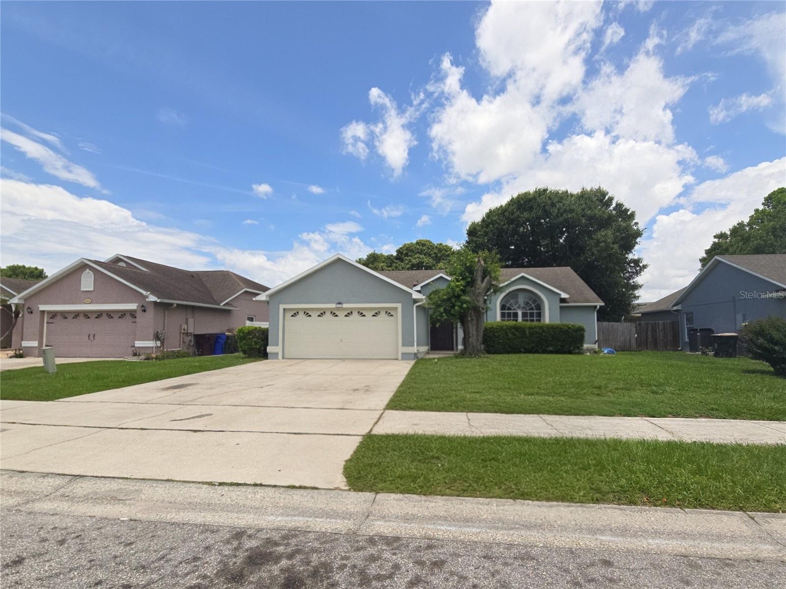 Ready for a new family beautifully maintained home ,  cherry wood cabinets, tiled though out fenced in yard. Quite community , easy access to Shopping , restaurants , schools,main roads , highways and Orlando attractions. Short ride to St Cloud's Lake front Park and Marina.  .