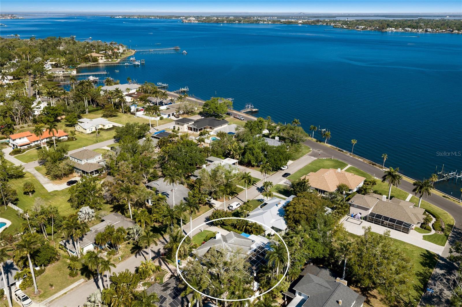 Virtually Staged. Opportunities like this rarely come along—a charming River District property just steps from the Manatee River with a separate guest suite and resort-style pool and custom tiki hut. Live, invest, or do both while enjoying sunset views and the ultimate Florida lifestyle. Tucked away in Bradenton’s coveted Historic River District, this character-filled retreat captures the essence of Old Florida charm blended with modern comfort and versatility. Enjoy evening strolls along the river, where glowing sunsets and gentle coastal breezes become part of your daily routine. The main residence offers 3 bedrooms and 2 bathrooms, filled with warmth and natural light throughout. Gleaming wood floors flow through the home, creating a timeless and inviting feel. The living room is centered around a fireplace, adding both charm and comfort, while the updated kitchen features rich wood cabinetry, sleek countertops, and stainless appliances designed for effortless entertaining. Enjoy a peek of the Manatee River from the kitchen window. The secondary bedrooms are bright and airy, each enhanced by abundant natural light and hardwood flooring. The third bedroom features a charming built-in bench seat, creating the perfect cozy nook. An additional sitting room or flex space is a standout feature, complete with built-in shelving and nooks and filled with beautiful natural light—ideal for a home office, reading room, or creative space. Step outside into your private tropical oasis, where a heated saltwater pool and spa are surrounded by lush landscaping and enclosed within a screened lanai for year-round enjoyment. The custom tiki hut bar and covered outdoor living area create the ultimate setting for entertaining or unwinding, perfectly capturing the relaxed Florida lifestyle.
A detached mother-in-law suite adds exceptional value and flexibility, offering a private one-bedroom, one-half bath space ideal for guests or extended family. This setup could be used for short-term rentals, seasonal use, or long-term investment opportunities. Additional features include a tankless hot water heater, water softener system, and a beautifully finished paver driveway and walkway that enhance both convenience and curb appeal. Located just minutes from downtown Bradenton’s vibrant dining, shops, and cultural attractions, yet nestled in a peaceful, walkable neighborhood near the river, this property offers a rare combination of lifestyle, charm, and income potential. This is more than a home—it’s an opportunity to own a distinctive piece of the River District with the flexibility to live, invest, or both.