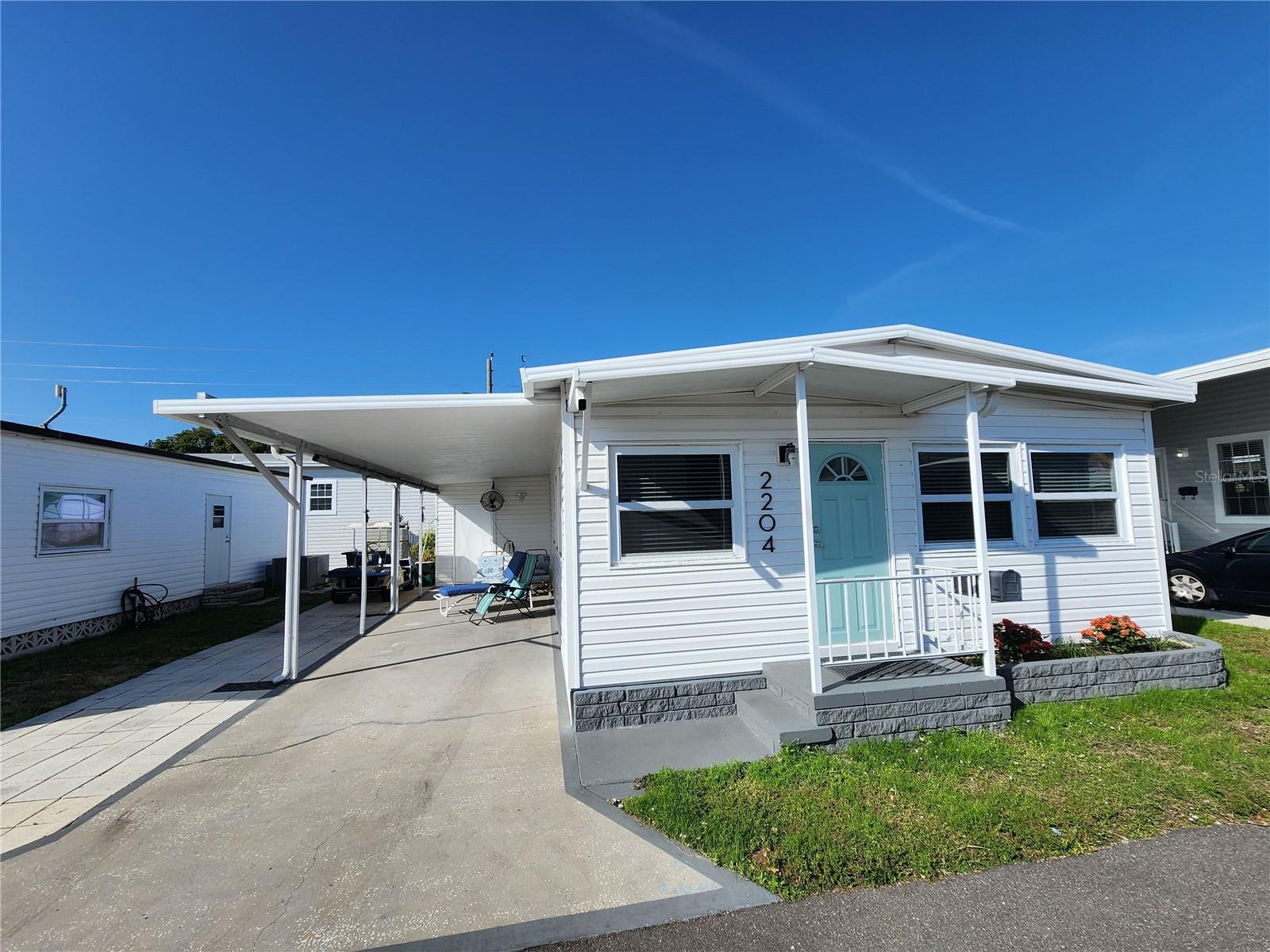 Just Reduced $10,000.  Don't miss this one.!!  Bradenton Tropical Palms.  Enjoy carefree living in this updated 2-bedroom, 2-bath double-wide home in a gated, land-owned 55+ community—NO lot rent! This move-in-ready unit offers a remodeled kitchen, laminate flooring, upgraded electric panel, vinyl roof, and A/C new in 2024. Most windows have been replaced with thermo-pane windows for added efficiency. Partially furnished.  Low maintenance fees and a vibrant community lifestyle await, featuring pickleball, shuffleboard, a community pool, and plenty of organized activities. Ideally located close to shopping, dining, and the Riverwalk. Rental restrictions apply (no rentals for 2 years; one unit/owner). Ideal for seasonal or full-time Florida living. New owner occupancy May 1, 2026.