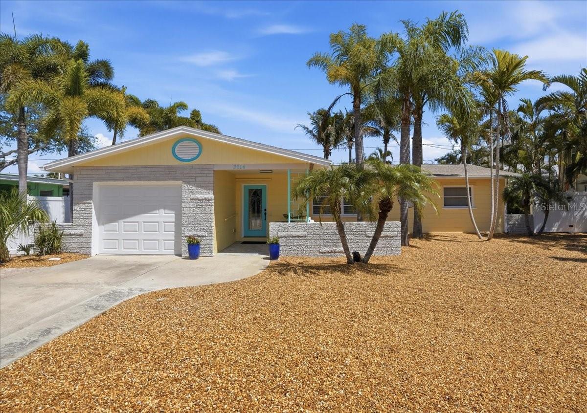 This amazing Gulfport property with 2 lots has so many great features you will feel like you are home!  It is nestled in this beautiful community where you can walk to downtown Gulfport and find beaches, shops, parks, bars, tons of restaurants, and a thriving Arts District.  This three bedroom, 2 bath house has a split floorplan and sits on a double lot with alley access and off street parking available.  It has many new updates: new kitchen with appliances, new water heater, new garage door and opener, newly finished terrazzo floors, and more.  The outdoor entertaining space will truly wow you!  There is plenty of room for friends and family to gather.  The house is surrounded by beautiful xeriscaping and a screened-in porch. There is plenty of room for a fire pit, outdoor kitchen, or even a pool here. Don't miss this chance to be part of this vibrant city!
