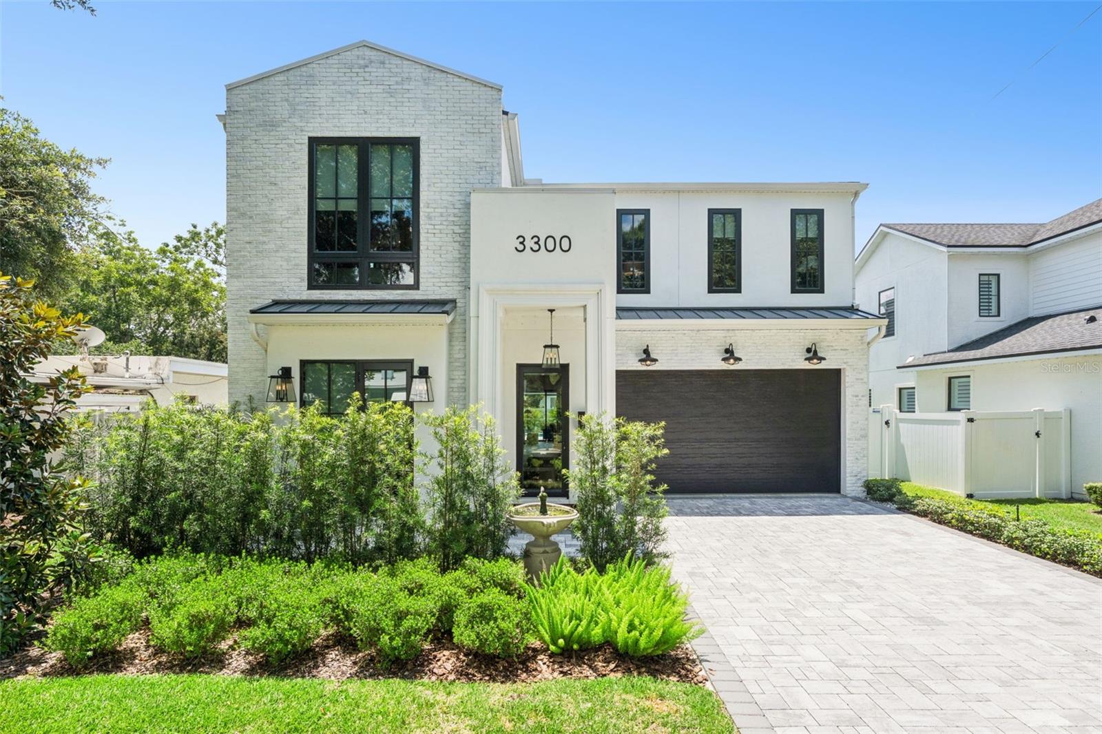 Welcome to this exceptional custom-built luxury residence in the heart of College Park, where timeless design, superior craftsmanship, and high-end finishes create an unparalleled living experience.  This stunning property offers over 3400 square feet of thoughtfully designed living space tailored for both everyday comfort and grand-scale entertaining.  With 5 bedrooms and 4 full bathrooms this home offers amazing comfort for a family and or your guests.  There are 3 bedrooms that offer en suite custom bathrooms and all bedrooms have walk in over sized closets!  
At the center of the home is a chef-inspired kitchen featuring premium Wolf gas cooktop, a Sub-Zero refrigerator, Thermador double ovens, Thermador dishwasher, custom cabinetry pull-outs, and expansive quartz countertops complete with convenient pop-up electrical outlets. Luxury wood flooring, designer lighting, custom millwork, and elegant finishes elevate every room throughout the home.  The living area is an open concept where the eat in kitchen, dining room and living area flow effortlessly along with glass retractable sliders that make the outdoor space part of the home!  Upstairs you will find an amazing custom movie loft area with custom wallpaper and wood trim!
The open-concept floor plan seamlessly blends indoor and outdoor living through dramatic retractable glass sliders that open to an extraordinary outdoor entertainment space. Enjoy year-round Florida living from the covered lanai featuring remote-controlled retractable screens, a wraparound granite entertaining bar, and a fully equipped summer kitchen with a built in gas grill, built in beverage refrigerator, and an ice maker.
The private backyard retreat showcases a sparkling saltwater pool, lush landscaping, garden space, and a white vinyl privacy fence, creating the perfect setting for relaxation and entertaining. Inside, custom wood trim accent walls add warmth and character to the living room, loft, and media room, while the versatile floor plan includes five spacious bedrooms, four full bathrooms, and a convenient first-floor powder bath.
Additional features include propane tank, EV charging capability, smart home technology, extensive storage solutions, custom closets, one of a kind wall paper and premium finishes throughout. Ideally located in the heart of College Park in the Princeton school district. Minutes from Winter Park, historic Park Avenue, and Downtown Orlando, this remarkable residence offers luxury, convenience, and sophisticated Florida living in one of Central Florida's most desirable neighborhoods.
Every detail has been carefully curated to create a home that is as beautiful as it is functional—a rare opportunity to own a truly exceptional College Park property.