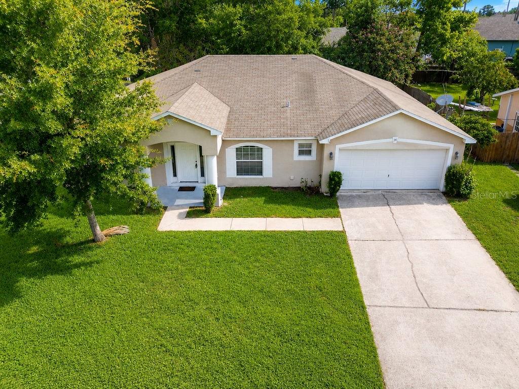 Welcome to 35 Belleaire Drive – Your Move-In Ready Palm Coast Retreat!
This beautifully maintained 3-bedroom, 2-bath concrete block home offers the perfect blend of comfort, space, and convenience in one of Palm Coast's most desirable locations. The thoughtful split-bedroom floor plan provides privacy and functionality for modern living.Step inside to discover an inviting open-concept layout that seamlessly connects the living spaces. The heart of the home features a stunning island kitchen – perfect for meal prep and entertaining – flowing into a spacious dining room and extra living room. A generous family room nestled between the bedrooms creates the ideal space for relaxation and family time.
Practical luxury continues with an oversized interior laundry room – no more trips outside! When it's time to unwind, retreat to your private screened-in porch overlooking the expansive backyard – your own slice of Florida paradise perfect for morning coffee, evening gatherings, or watching the sunset.
Perfectly positioned just off Belle Terre Parkway, you'll enjoy ultimate convenience with shopping, dining, and entertainment all within minutes. Plus, you're just a short drive to the pristine shores of Flagler Beach and the historic charm of St. Augustine.
This move-in ready gem is waiting for you – no projects, just pack your bags and start living the Florida lifestyle!