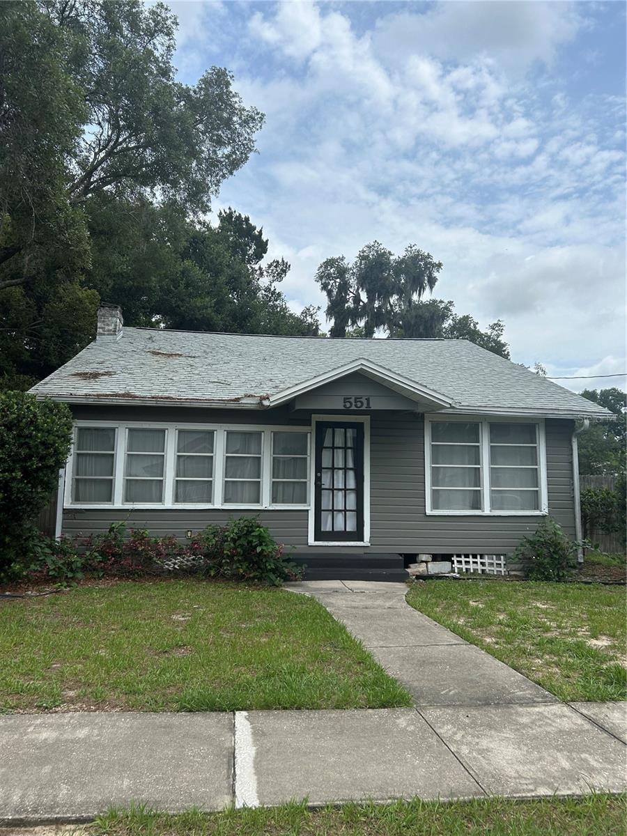 Step into the timeless charm of this absolutely adorable 1925 historic bungalow, ideally located just blocks from the heart of Downtown Mount Dora. Offering 2 bedrooms, 1 bathroom, and an abundance of character, this beautifully maintained home blends vintage charm with thoughtful updates, just minutes to Mount Dora's acclaimed shops, restaurants, waterfront, parks, festivals, and year-round events.

Inside, you'll find a bright, airy interior filled with natural light from an abundance of windows, creating a warm and inviting atmosphere throughout. The spacious floor plan features separate living and dining rooms, beautiful original woodwork, intricate moldings, built in cabinetry, a cozy fireplace, and stunning wood ceilings that showcase the craftsmanship of a bygone era. Brand-new carpet adds fresh comfort while complementing the home's historic appeal. A sun drenched bonus room offers incredible flexibility and is perfect for a home office, fitness room, playroom, reading nook, hobby space, or additional living area.

The charming kitchen combines classic style with modern functionality, featuring butcher block countertops, a farmhouse sink, gas stove, and an abundance of cabinet storage. The retro inspired bathroom is full of personality with its vintage tilework and tub/shower combination. There are hook-ups for washer and dryer.

Step outside to enjoy the fully fenced backyard, offering plenty of space for entertaining, gardening, or relaxing around the fire pit. A storage shed provides additional room for tools and equipment, while the one-car carport adds everyday convenience.

Whether you're looking for a full-time residence, weekend getaway, or investment opportunity, this one-of-a-kind historic home offers the perfect combination of charm, character, flexible living space, and an unbeatable downtown location. Come experience the Mount Dora lifestyle from your own front porch! Owner may consider one small non-dangerous breed dog or a cat on case by case basis