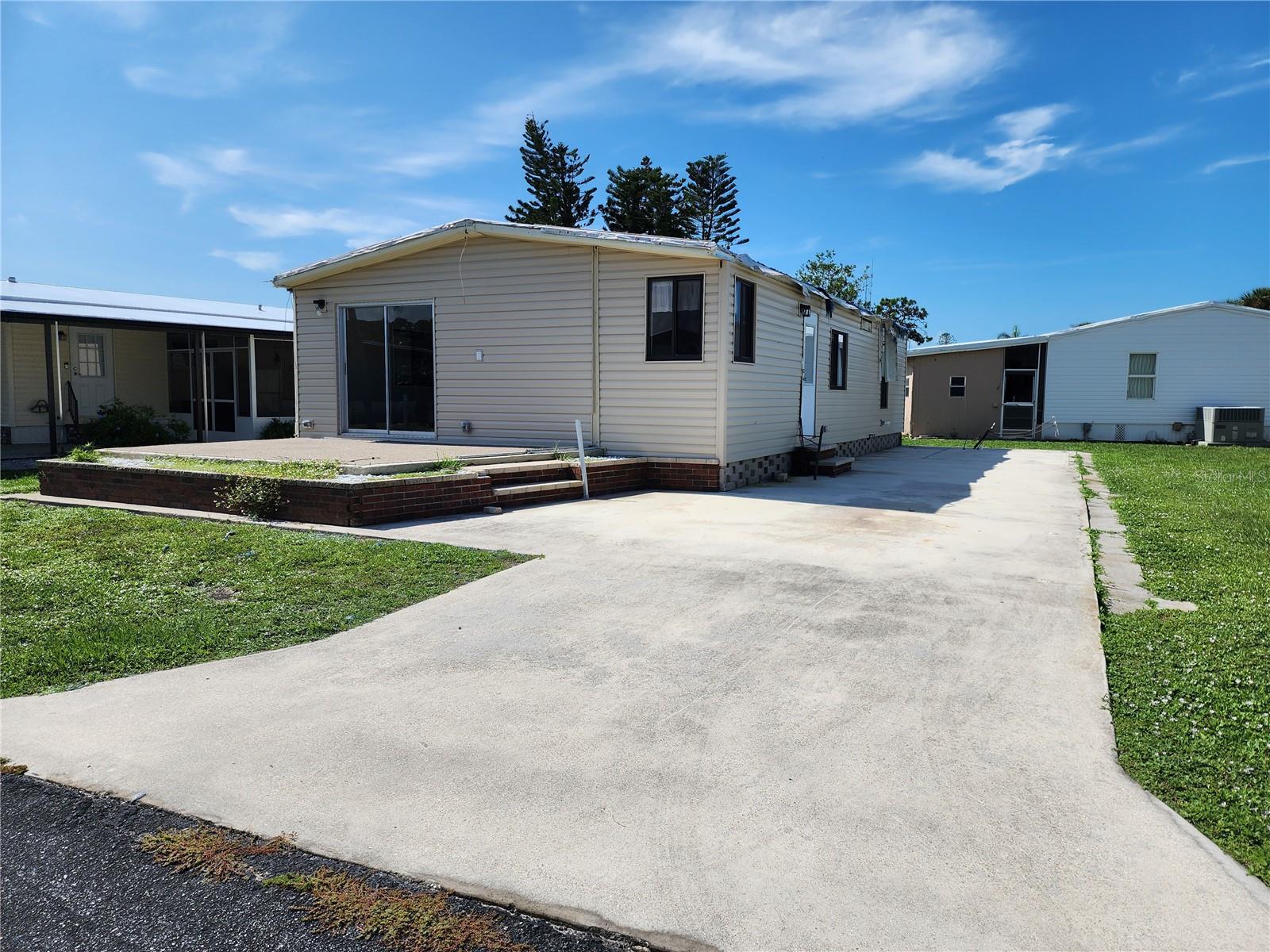 Opportunity Awaits! Welcome to this active 55 and older community of Polynesian Village, located approximately one mile to Manasota Beach and boat ramps!  Extra Storage available for your boat, RV or trailer or space for shed/storage at 130/yr.  And you can't beat the Location! You can walk, drive or bike to the beach. Polynesian Village amenities include a community pool, sun deck, 3 shuffleboard courts and a beautiful newly remodeled gathering room/clubhouse that hosts many entertainment events planned by the social community for fun activities and camaraderie. This is a Golf Cart friendly community so bring your golf cart. This 2 bedroom, 2 bath home suffered damage from the hurricane and lost the carport along with a Lanai; there is a slab/foundation for the sun porch in the front of the home. This model offers a great open floor plan creates a feeling of a large open living space.  The home has several updates done prior to the storm including Roof; Updated Electric to bring to code and also all new plywood subflooring per seller.  There is damage from the hurricane (See photos) and it has been priced accordingly. This listing provides an affordable opportunity to own in this wonderful community. Call today!