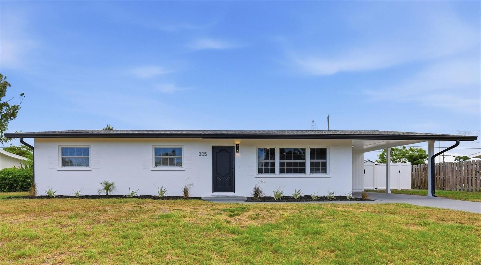 WOW - this fully renovated POOL HOME is the total package! Tucked into the heart of Venice Gardens, this bright and beautiful 3-bedroom, 2-bath stunner has been taken down to the studs and rebuilt for modern living. The showstopping open-concept great room flows seamlessly into a designer kitchen featuring crisp shaker cabinetry, gleaming quartz countertops, a full-height marble-look backsplash, stainless steel appliances, and an oversized peninsula with bar seating - all wrapped in wood-look tile flooring throughout and bathed in natural light. The spa-inspired bathrooms shine with sleek tile showers, frameless glass, modern vanities, and backlit LED mirrors. Step out back to your private Florida oasis: a screened, sparkling pool with a spacious patio, built-in outdoor grilling station, and a fully fenced yard with room to roam. Enjoy total peace of mind with a BRAND-NEW A/C, NEWER ROOF, NEW ELECTRICAL PANEL, UPDATED PLUMBING, and 2025 water heater - every big-ticket item is done! Covered carport parking, NO HOA, and NO deed restrictions. Minutes to Gulf beaches, shopping, dining, and the optional Venice Gardens pool & clubhouse. Move-in ready and loaded - don't miss this one!