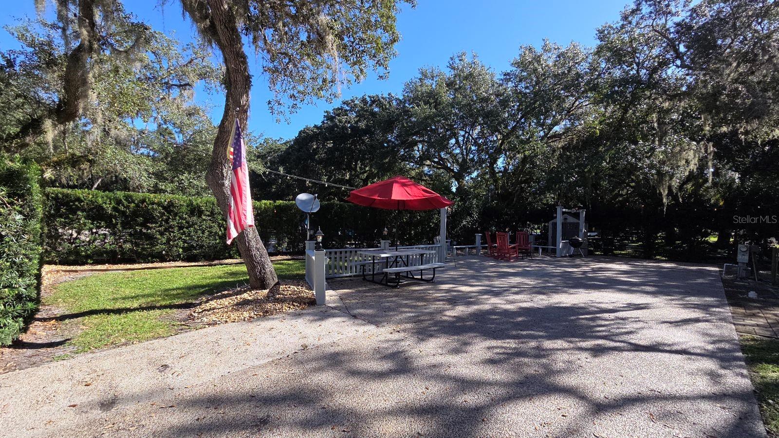 Luxury RV Lot in Central FL!  WELCOME TO RIVER RANCH RV RESORT, Florida’s Luxury RV Resort with access to Lake Kissimmee!  This privately owned RV lot is located in Phase 3 and sits on a Corner Lot just steps from laundry, pool, pickleball courts, shuffleboard, bathhouse and more!  This Lot offers privacy, lush foliage, dedicated golf cart parking, grassy area for your fur-babies and is big rig friendly!   This lot has an extended concrete patio with room for outdoor kitchen space, pavilion, additional tables and seating areas.  There is a shed in place for added storage.  This lot offers shade and sun  - the perfect combination!   River Ranch RV Resort is perfect for weekend vacations, family camping, seasonal living! River Ranch RV Resort offers beautiful landscaping and privately owned RV lots.  There are many amenities such as Pools, Tennis, Pickle Ball, Clubhouse, Social Events, Billiards, Poker Room and more!  WHY BUY AT RIVER RANCH? Turnkey Rental Income Opportunity, High-Demand Vacation Destination, Privately Owned RV Lots – Perfect for weekend getaways or full-time living!
Low Maintenance Investment – HOA covers water, sewer, trash, cable & more!  River Ranch is more than just a Resort - It is a Lifestyle!  Live Rodeo Every Saturday Night – Experience the Wild West!  Saloon Fun – Live music, DJs, line dancing & family-friendly vibes!  Adventure Park – Airboat rides, mechanical bull, mini golf, arcade & more!  Resort Amenities – Pools, tennis, pickleball, poker room & social events!  Dining on Property – BBQ, steakhouse, pizza, Starbucks & ice cream!