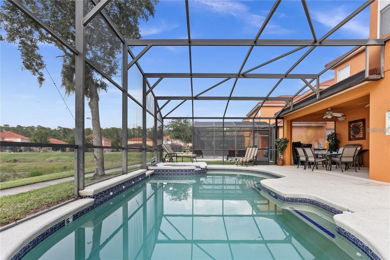 Welcome to this stunning **fully furnished** 6-bedroom, 5.5-bathroom home located in the highly sought-after, guard-gated Bella Vida Resort in Kissimmee. Offering over 3,500 square feet of beautifully designed living space, this spacious home is perfect for families, corporate relocations, or anyone looking to enjoy the best of Central Florida.

The first floor features an elegant formal living room and dining room, a spacious open-concept kitchen with breakfast nook, and a bright family room with large windows overlooking the private pool and tranquil water view. The open layout is ideal for both everyday living and entertaining.

Upstairs, you'll find all six generously sized bedrooms, including a luxurious primary suite with a private ensuite bathroom, three additional guest suites with their own private bathrooms, and two bedrooms connected by a Jack-and-Jill bathroom—providing plenty of space and privacy for everyone.

Step outside to your own private oasis featuring a screen-enclosed swimming pool, heated spa, spacious patio, outdoor shower, and peaceful lake views—the perfect place to relax after a day exploring Central Florida.

This home is offered **fully furnished** and includes all furnishings, electronics, décor, and household essentials, making it truly move-in ready.

Rent Includes:
* Cable TV & HBO
* Daily valet trash pickup
* Access to all Bella Vida Resort amenities

Residents enjoy an outstanding selection of resort-style amenities including:  24-hour guard-gated entrance,  Resort-style zero-entry swimming pool, 6,700 sq. ft. clubhouse, State-of-the-art fitness center, Private movie theater, Sports courts,  Playground and more

Conveniently located ust 15 minutes from Walt Disney World® Resort, Bella Vida also offers easy access to Universal Orlando Resort, SeaWorld Orlando, Orlando International Airport, major highways, world-class shopping, Premium Outlets, restaurants, golf courses, and all the attractions Central Florida has to offer.

*1 or 2 Year Lease Available

Don't miss this exceptional opportunity to lease a beautifully appointed resort-style home in one of Kissimmee's premier gated communities!