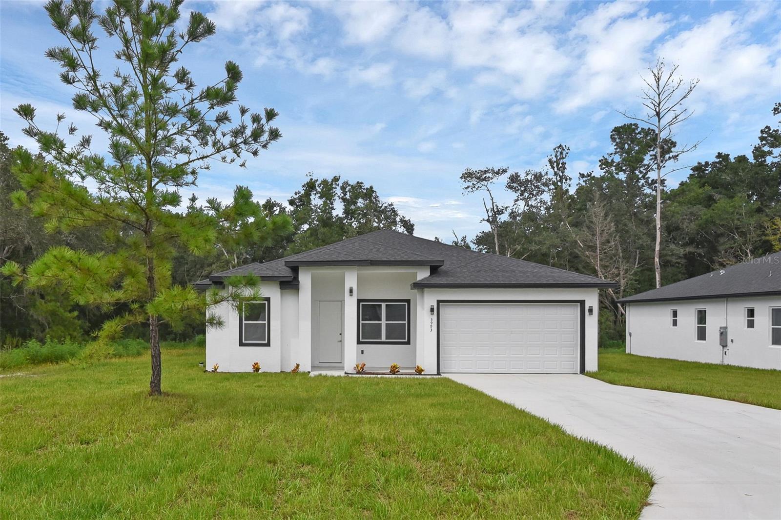 Pre-Construction. To be built. No HOA | No CDD | Short-Term & Long-Term Rentals Allowed

Exceptional opportunity to own a modern new construction home in Dunnellon, Florida, one of the fastest-growing areas in Central Florida. Located just minutes from Ocala with convenient access to Gainesville, Tampa, and Orlando, this property offers the perfect combination of lifestyle, location, and investment potential.

This thoughtfully designed home features 3 bedrooms, 2.5 bathrooms, a private office (which can easily serve as a 4th bedroom), and a spacious 2-car garage. The open-concept layout includes 10-foot ceilings, abundant natural light, and a modern kitchen with wood cabinetry, stone countertops, and stainless steel appliances including refrigerator, dishwasher, microwave, and range.

The home also offers a covered lanai ideal for outdoor living and entertaining. The spacious primary suite features elegant finishes and generous closet space, while the split-bedroom layout provides comfort and privacy.

High-quality laminate flooring throughout the living areas and bedrooms adds both durability and style.

Perfectly located just 8 minutes from Rainbow Springs State Park, about 35 minutes to the Gulf Coast, and close to three navigable lakes, making it ideal for outdoor enthusiasts. Convenient access to shopping, schools, and major employers including Amazon and Publix.

Ideal for primary residence, vacation home, or investment property. The property allows Airbnb, short-term rentals, and long-term leasing, offering strong income potential.

Estimated completion approximately 7 months after construction begins.

Secure your brand-new home or next investment opportunity in one of Florida’s most promising growth areas.