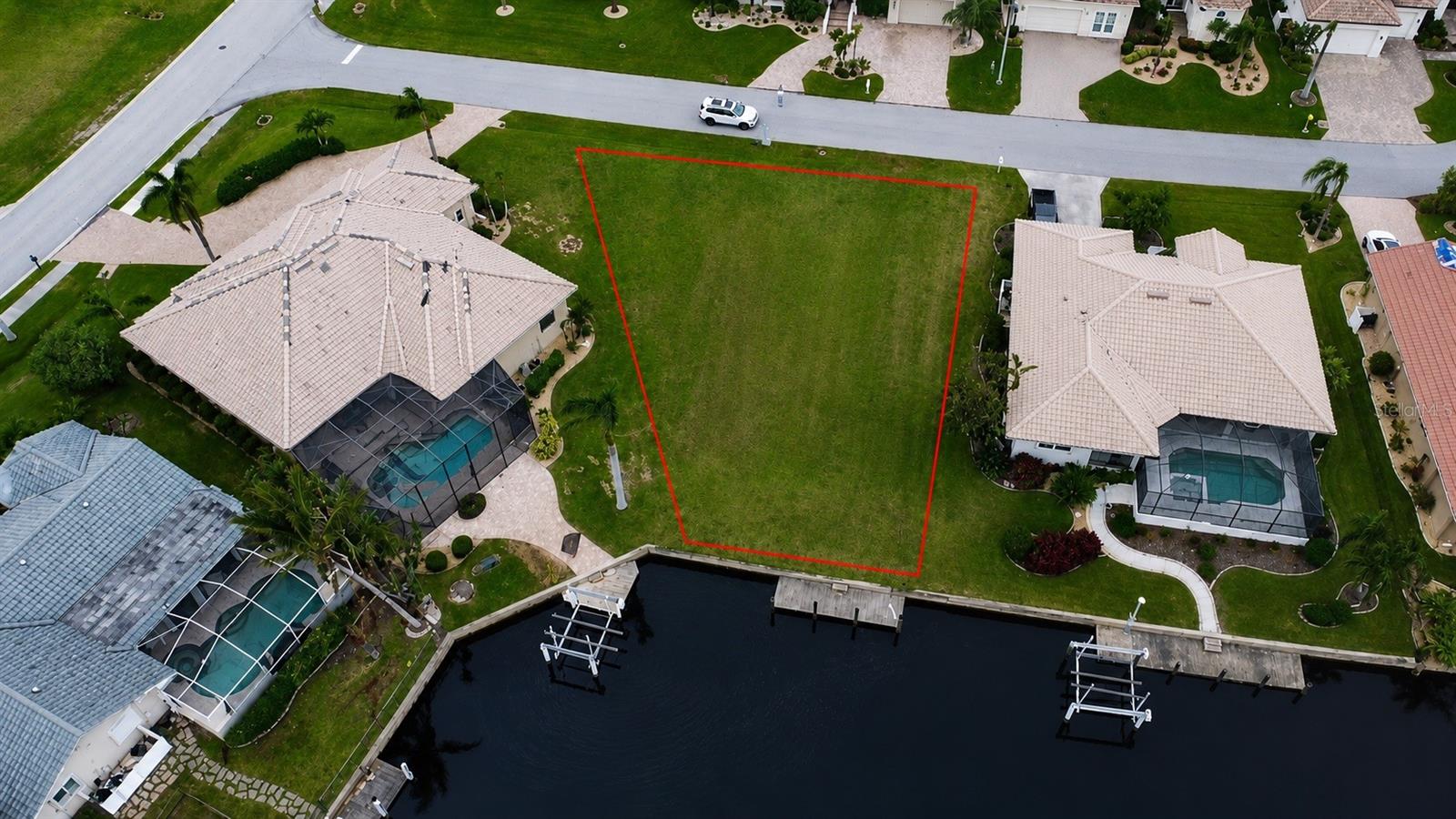 Build your dream waterfront home in the highly desirable Burnt Store Isles. This exceptional sailboat-access homesite features 58 feet of city-maintained concrete seawall, a private concrete dock, expansive long water views, and quick, bridge-free access to Charlotte Harbor and the Gulf of Mexico through Alligator Creek.

Surrounded by beautiful custom homes, this lot offers public water and sewer and is ready for your dream build. Spend your days cruising to Boca Grande, Cabbage Key, and Little Gasparilla Island, or enjoy world-class fishing and sailing on Charlotte Harbor, one of Florida's premier boating destinations. Just minutes from historic downtown Punta Gorda, Fishermen's Village, waterfront dining, shopping, parks, and Twin Isles Country Club, this is an exceptional opportunity to build the waterfront lifestyle you've been dreaming of.