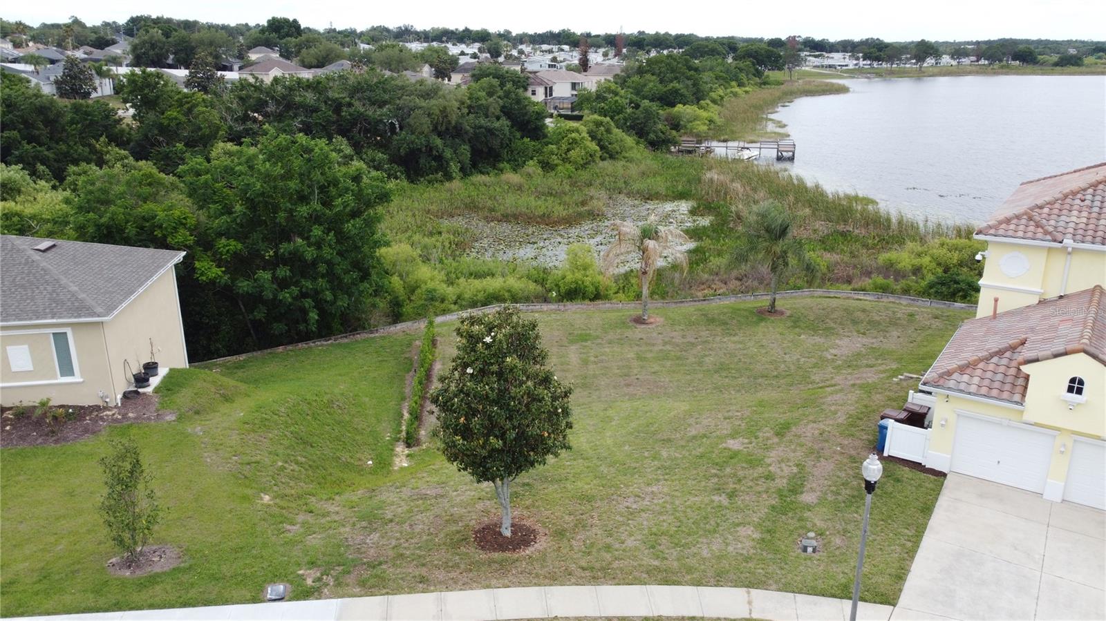 Beautiful lakefront lot on Tower Lake offering an exceptional opportunity to build your ideal Florida home. Situated in an established gated and guarded community, this property is located on a charming cul-de-sac near the community entrance and enjoys lovely water views. Tower Lake allows water skiing, and residents have access to a private boat ramp, making it perfect for those seeking an active waterfront lifestyle. The community permits both full-time residence and short-term rental use, providing flexibility for homeowners and investors alike. Conveniently located close to shopping, dining, and medical facilities, and just a short drive to Central Florida’s world-renowned attractions. Don’t miss the chance to create your own piece of paradise on Cherokee Ave.