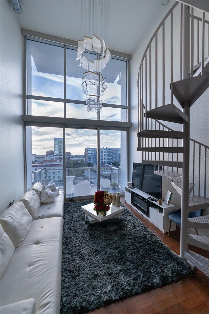 Welcome to this stunning two-story downtown condo loft that perfectly blends modern aesthetics with urban living. Located in the heart of the city, this property offers a unique living experience that's sure to impress. Here's a detailed description of what this exceptional space has to offer:Step into this contemporary condo loft and be greeted by an open, airy atmosphere with an abundance of natural light. The open-concept main floor is a perfect space for relaxation and entertainment. The generous living area seamlessly connects to the modern kitchen, creating a harmonious flow. The kitchen features state-of-the-art appliances, sleek cabinetry, and ample counter space for the gourmet chef in you. The bathroom is a sleek, modern space, with contemporary fixtures and a clean design. An in-unit washer and dryer add convenience to your daily routine. This condo complex offers a range of amenities for residents, including a fitness center, a rooftop terrace with stunning views, and secure underground parking for your peace of mind.Situated in the heart of downtown, you'll have easy access to a variety of shops, restaurants, theaters, and cultural attractions. The neighborhood is vibrant and lively, making it the perfect place to experience city living at its finest.Don't miss the opportunity to make this unique property your own and experience downtown living like never before. Contact us today for a viewing!