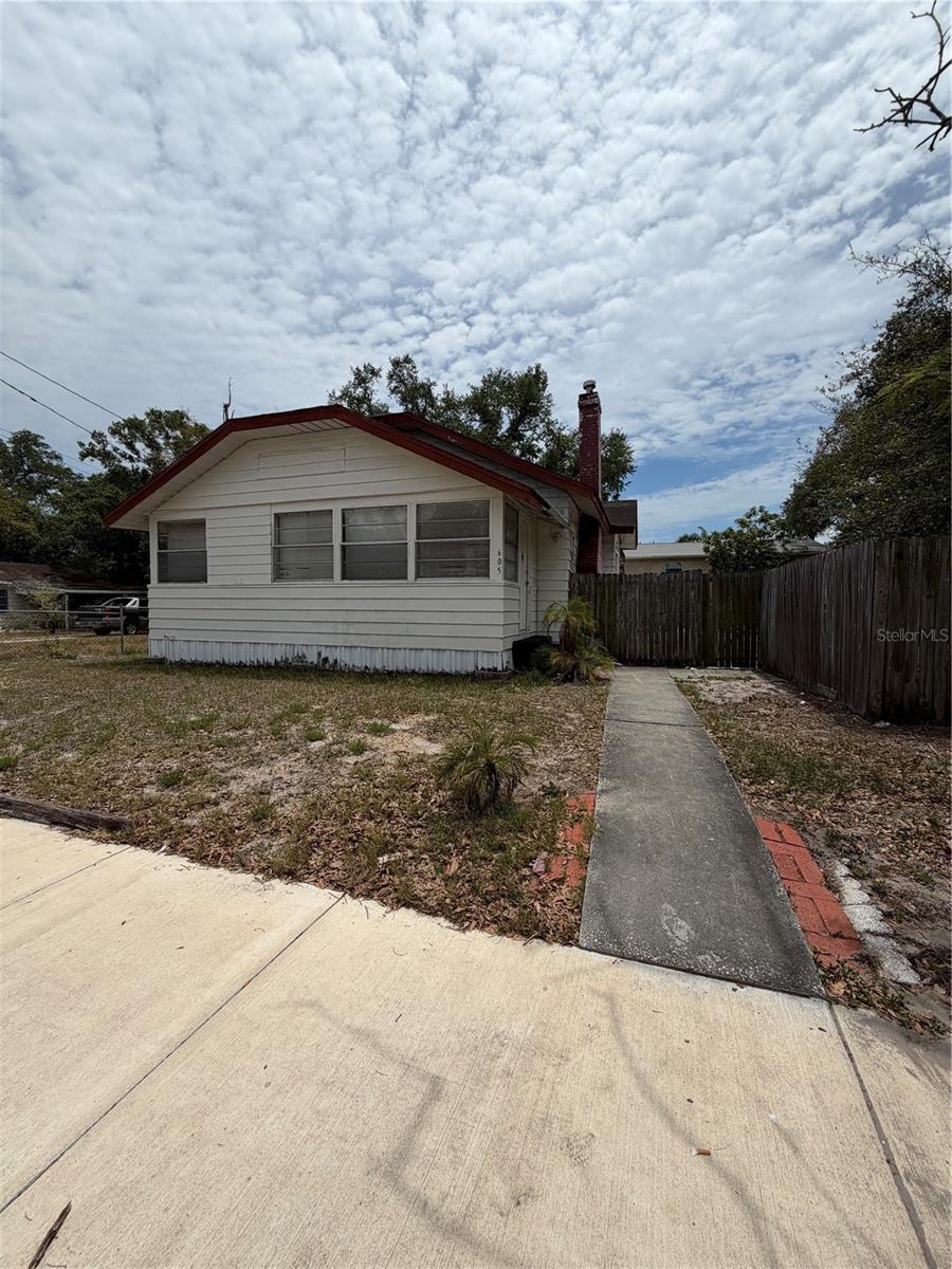 Rare investment opportunity in a highly desirable Clearwater location! Situated on an oversized double corner lot spanning over a quarter acre, this property offers exceptional potential for investors, builders, and renovation enthusiasts. The property features a 3-bedroom, 2-bath main residence with 1,292 square feet of living space, a detached 480-square-foot guest house/ADU, and a private in-ground pool—all ready for restoration and customization. This is a complete rehab project being sold for cash buyers only. The expansive lot, detached guest house, and pool create endless possibilities for a profitable renovation, income-producing property, multigenerational living arrangement, or future redevelopment opportunity. An added bonus is that the property is located in a non-flood zone, providing peace of mind and eliminating the need for flood insurance. Conveniently located just minutes from Belleair Country Club, Clearwater Beach, shopping, dining, parks, and major roadways, this property combines location, land, and potential in one unique package. Opportunities like this with a double lot, detached ADU, pool, and no flood zone designation are increasingly hard to find. Bring your vision and unlock the tremendous value this property has to offer.