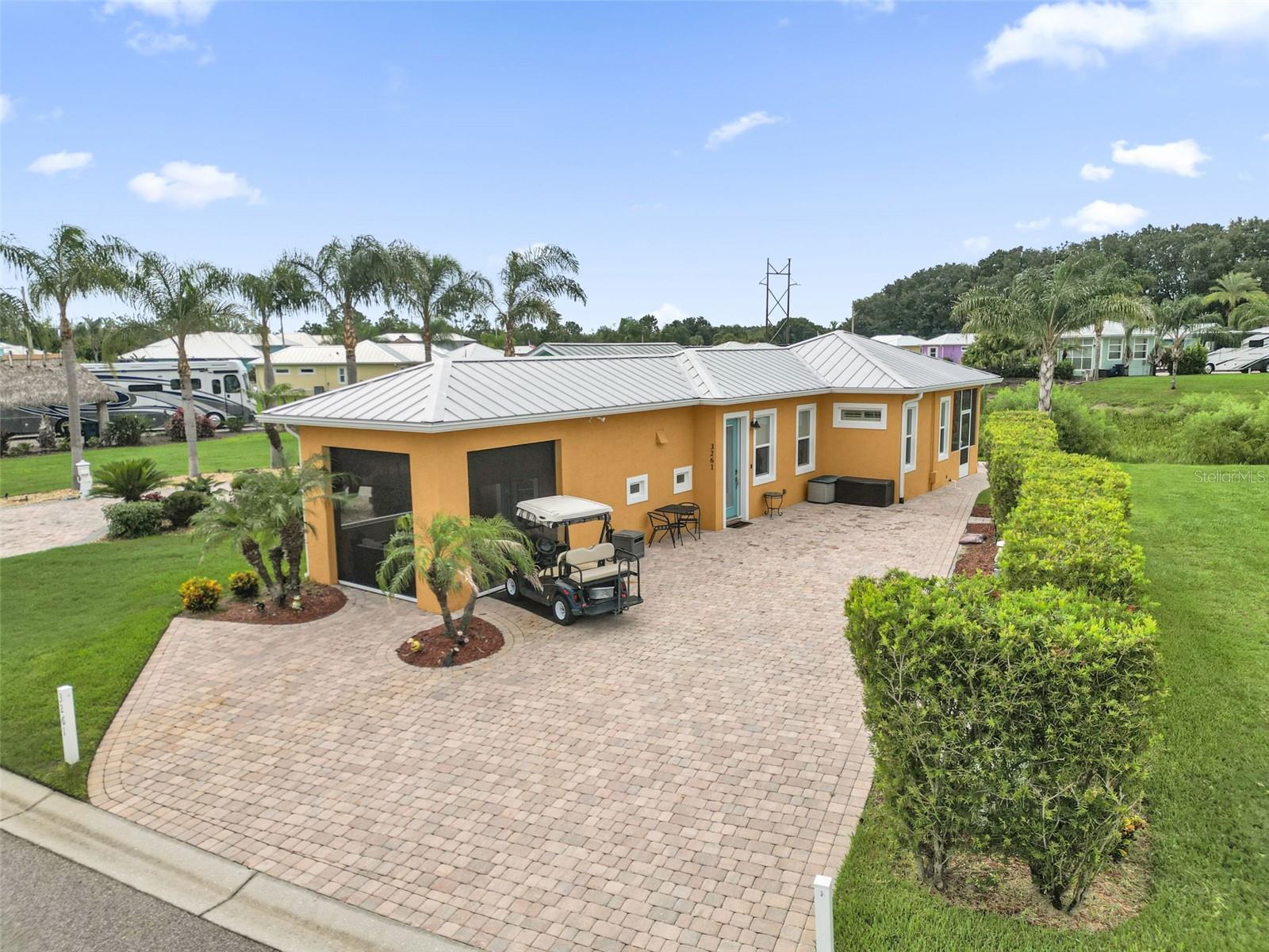 Welcome to luxury Class A motorcoach living in Bay Lake Motorcoach Resort! This beautifully maintained custom casita, built in 2021, offers the perfect blend of comfort, style, and resort living. Sold fully furnished including all furniture, appliances, and fixtures this move-in-ready property allows you to start enjoying the Florida lifestyle from day one.

Offering 819 sq. ft. of heated living space (1,048 sq. ft. under roof), the home features an open-concept living area, a well-appointed full kitchen, one spacious bedroom with a king-size bed, a private en-suite bath, and an additional full guest bathroom.

Relax on the screened front porch with automatic roll-down screens while enjoying peaceful views of Lake Mattie, or unwind on the rear patio overlooking a tranquil pond. The oversized paver pad provides ample space for your Class A motorcoach, and the convenient lake access road makes parking and maneuvering your coach effortless.

Bay Lake Motorcoach Resort is a gated, resort-style community designed exclusively for Class A motorcoach owners. Residents enjoy exceptional amenities, including a clubhouse, resort-style pool and spa, fitness center, social clubs, planned activities, and a welcoming community atmosphere. Whether you're looking for a seasonal retreat or a full-time residence, this exceptional property offers the perfect opportunity to experience Florida resort living at its finest.