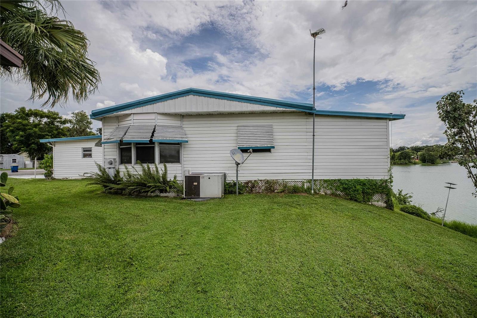 Welcome to waterfront living!!  This inviting 2 bedroom, 2 bathroom double-wide home with a bonus room and a bright Florida room, can be found perfectly situated in the highly sought-after Floral Lakes, a 55+ lakefront community. Inside, you’ll find a convenient kitchen passthrough to the dining area with a built-in dry bar, plus a comfortable split of living spaces ideal for relaxing or entertaining. Major updates include a 2-year-old HVAC system, a durable metal roof with plenty of life left, and replaced flooring and subfloors—giving peace of mind for years to come.  Floral Lakes is known for its friendly atmosphere, very low HOA fees, no CDDs, and absolutely NO LOT RENT. Residents enjoy private boat ramp access to the lake for boating and fishing, a sparkling lakeside pool, shuffleboard courts, a clubhouse, and a park. Golf carts are welcome, and the calendar is always full of activities designed to keep you active, social, and entertained.

Don’t miss the chance to enjoy lakeside living in a vibrant community where every day feels like vacation!  Vacant and EASY TO SHOW.  Schedule your showing today