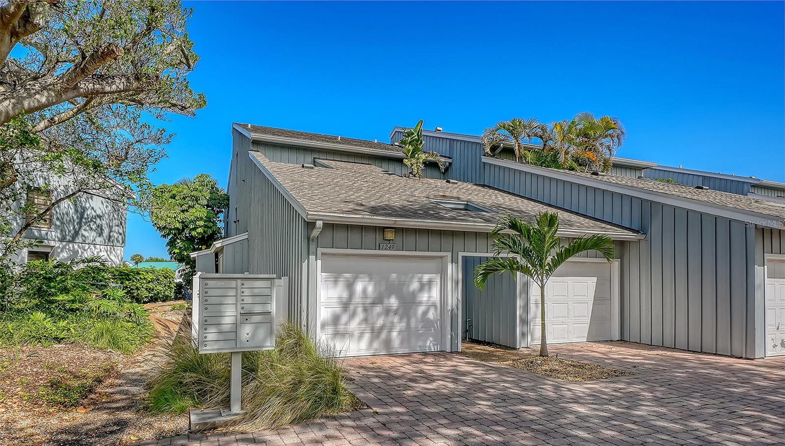 Welcome to your slice of paradise on Siesta Key! This beautifully maintained two-bedroom, two-bath first-floor end unit offers a blend of comfort, convenience and coastal living with no stairs to climb and easy access throughout. Ideally just a short two-block stroll to world-famous Siesta Key Beach, you’ll enjoy powdery quartz sand that stays cool underfoot, even on warmest days. This well-maintained island condominium features a roomy layout and comes fully furnished, making it move-in ready or ideal as an income-producing rental. The generous screened lanai overlooks the peaceful marina, creating a spot to relax with your morning coffee or unwind at sunset. Boating enthusiasts will appreciate the sought-after deeded boat dock, providing direct water access to the Intracoastal Waterway. The private garage with overhead storage offers plenty of extra space for beach, fishing gear and more. Within the desirable Harbour Towne community, residents enjoy a host of amenities including a heated swimming pool, spa, tennis and pickleball courts, plus a welcoming clubhouse known for its friendly, social atmosphere. Whether you're seeking a seasonal getaway or investment opportunity, this condominium checks every box. Enjoy the laid-back Siesta Key lifestyle with dining, shopping and entertainment just minutes away, all while living near one of the world’s celebrated beaches.