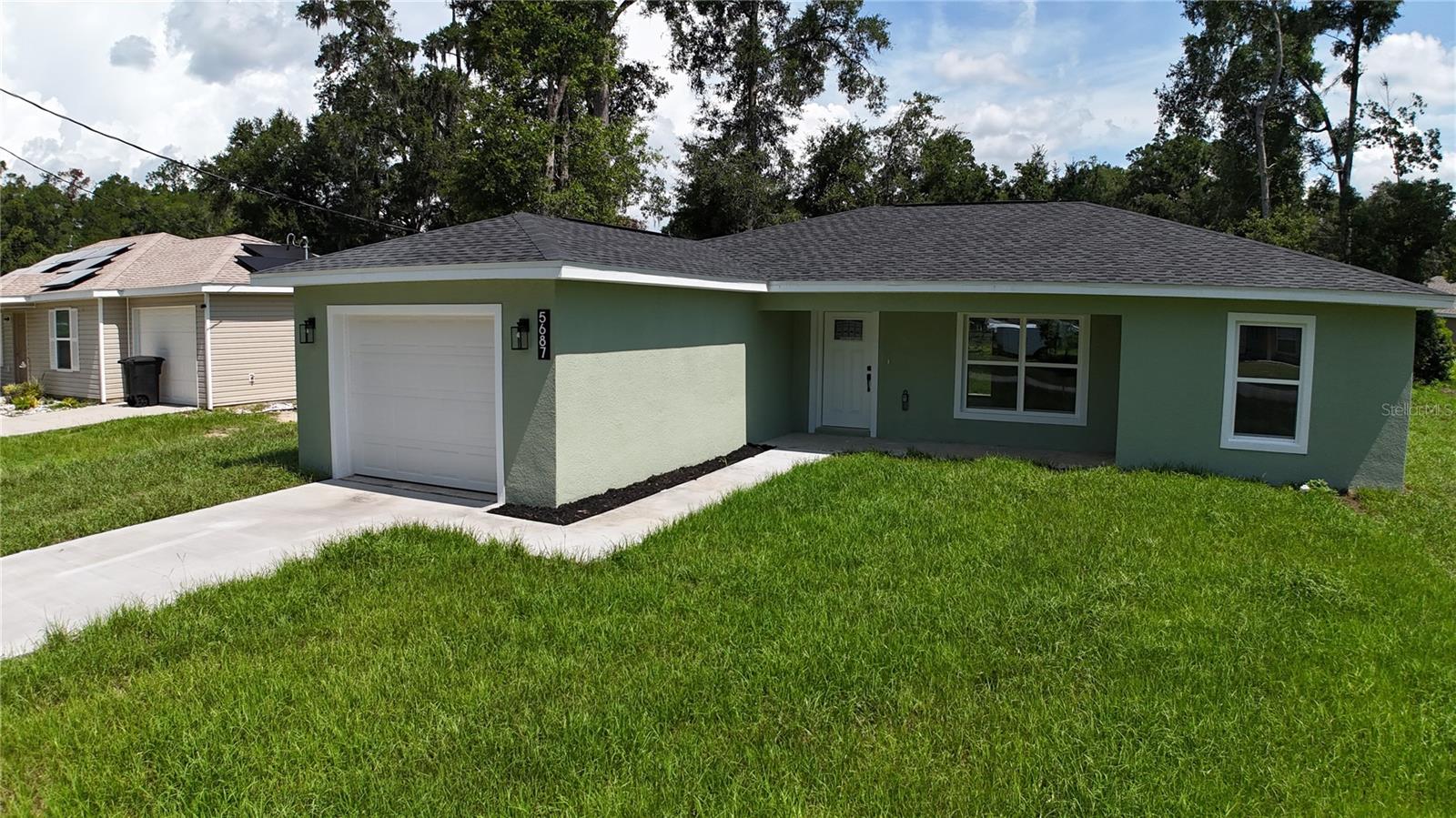 Welcome home. This beautifully crafted 3bd/2ba new construction is located on the back doorstep of Ocala Park Estates. This gorgeous residence delivers the perfect blend of modern design, quality construction, and an unbeatable Ocala location. From the moment you step inside, the attention to detail and fresh, clean finishes make it clear that this home was built to impress.
The open and airy floor plan flows naturally from room to room, creating a warm and inviting atmosphere ideal for both everyday living and effortless entertaining. The kitchen is bright and modern, the bathrooms are clean and elegantly finished, and the bedrooms are generously sized and full of natural light. Schedule a showing today to find out for yourself!