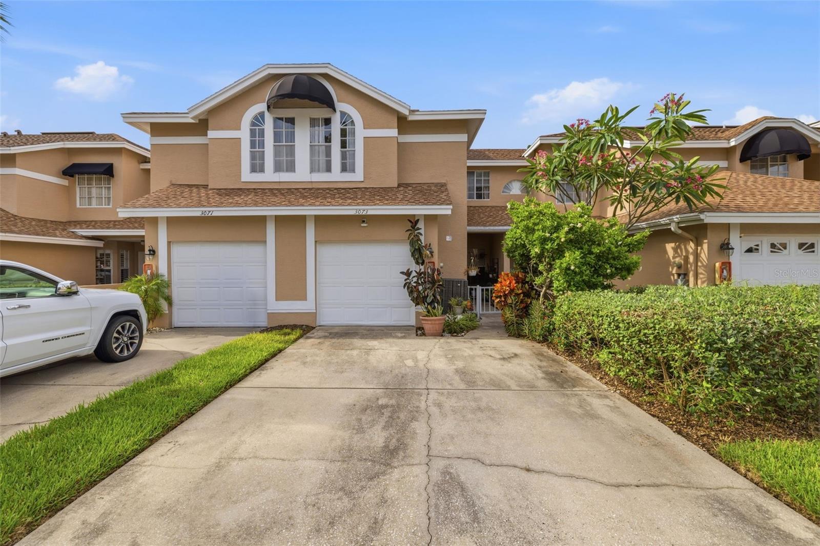 This beautifully updated 3-bedroom, 2.5-bath home in the desirable Overlook community is sure to impress. MANY UPDATES IN 2022! Recent improvements include a newer A/C, a fully remodeled primary bathroom, an updated kitchen, an enclosed screened in porch off the primary bedroom, and luxury vinyl plank flooring throughout, offering both style and durability.

Step inside to a bright and inviting floor plan designed for comfortable living and effortless entertaining. The updated kitchen features a convenient breakfast bar, perfect for casual dining or gathering with family and friends.

The spacious primary suite serves as a private retreat with an oversized walk-in dressing closet and a beautifully renovated en-suite bathroom complete with a separate shower and relaxing soaking tub. Sliding glass doors lead to the enclosed screened in porch, creating the perfect space to enjoy your morning coffee while overlooking the peaceful estuary.

The HOA offers outstanding value by covering the roof, exterior building maintenance, lawn care, water, trash service, and flood insurance for the building's exterior. Residents also enjoy access to the community's geothermally heated pool, providing comfortable swimming and relaxation throughout the year.

Offering added peace of mind, this home remained high and dry during Hurricane Helene with no flooding, making it an exceptional choice for buyers seeking the Florida lifestyle without the worry. Residents also enjoy access to the community seawall, where you can conveniently launch a kayak or paddleboard and explore the surrounding waterways.

Just minutes away, Largo Datsko Park offers walking trails, open green space, a playground, tennis and pickleball courts, basketball courts, and recreational amenities for all ages, adding even more to this home's outstanding location.

Ideally located just minutes from TPA and PIE Airports, shopping, dining, major roadways, and some of Florida's most beautiful Gulf beaches, this move-in-ready home combines modern updates, an unbeatable location, and exceptional comfort. Don't miss your opportunity to make it yours!