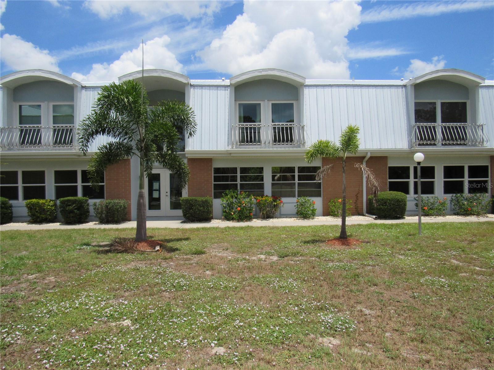 Beautiful, completely uddated, FIRST FLOOR condo located in the 55+ community of Edgewater Manor.  Step outside the spacious Florida room and enjoy direct access to the community pool.  Inside you will find luxury vinyl and ceramic tile floors throughout.  The kitchen has been updated with solid wood, raised panel cabinetry with soft close doors and drawers and 2 lazy susans.   Also featured are brand new stainless appliances.  Both bathrooms have been completely updated, also!  Impact windows and sliders  were installed in 2021 everywhere (except for the Florida room),  The roof on the building was replaced with metal in 2023 and the A/C was replaced in 2025.  Included is covered parking directly across from the building. Edgewater Manor's prime location is close to shopping, restaurants, Downtown Historic Punta Gorda, Fisherman's Village fisshing, boating and more.  Don't miss out on this wonderful opportunity!
