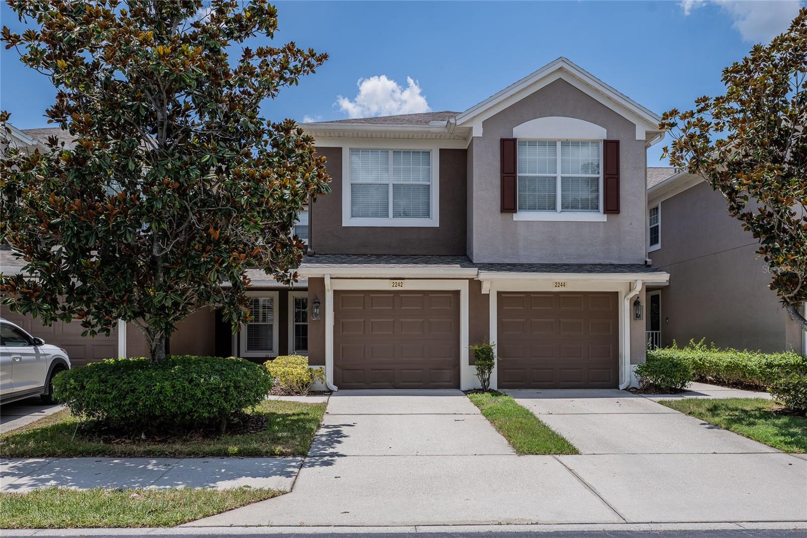 Rare opportunity to own a beautifully maintained, ONE-STORY villa-style home in the highly sought-after gated community of Villa Serena! Enjoy the ease of FIRST FLOOR living with the feel of a single-family home, all while benefiting from maintenance-free ownership. Perfectly positioned directly across from the community pool, fitness center, and clubhouse, this exceptional residence is also just minutes from I-75, the Selmon Expressway, Brandon, downtown Tampa, shopping, dining, and entertainment.  This move-in-ready home has been exceptionally cared for and offers 3 bedrooms, 2 bathrooms, an attached 1-car garage, and a spacious open-concept floor plan with soaring ceilings, and abundant natural light throughout the entire space. At the heart of the home, the beautifully appointed kitchen showcases designer-inspired natural wood-grain cabinetry with a contemporary flat-panel design, sleek solid-surface countertops, coordinating  appliances, modern hardware, closet pantry, and a sunny breakfast nook. The warm wood tones create a custom, upscale look that beautifully complements today's design trends. The spacious primary suite offers a relaxing retreat with a walk-in closet, dual vanities, a makeup station, and a walk-in shower. Stylish sliding barn doors have been added to both the primary bathroom and the second bedroom, enhancing the home's modern appeal while maximizing usable space. The third bedroom features elegant double-door entry and is currently configured as a den, making it ideal as a home office, media room, or guest space while easily serving as a third bedroom when needed. Triple sliding glass doors lead to a covered and screened lanai surrounded by privacy landscaping, creating the perfect place to enjoy your morning coffee or unwind at the end of the day. Villa Serena offers a true lock-and-leave lifestyle with community features that include water, sewer, trash, roof maintenance, exterior building maintenance, grounds maintenance, and pest control. Residents also enjoy resort-style amenities including a community pool and spa, fitness center, clubhouse, and scenic fishing ponds. Whether you're searching for a year-round residence or a seasonal Florida getaway, this meticulously maintained home offers the perfect combination of style, comfort, convenience, and carefree living in one of Riverview's most desirable communities.