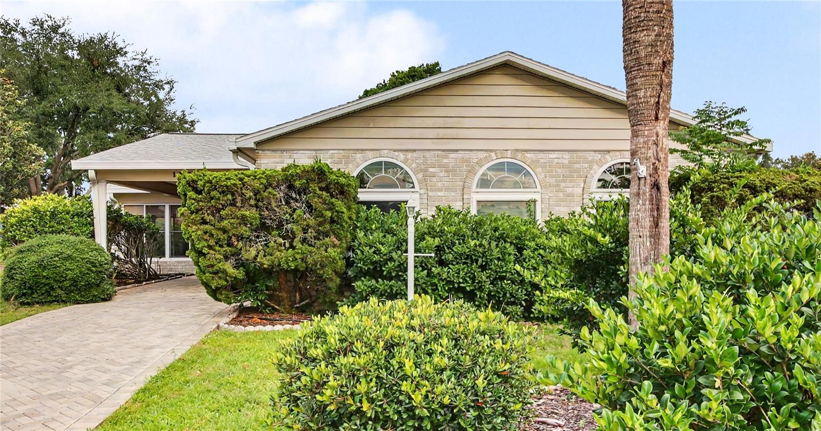One or more photo(s) has been virtually staged. Nestled on a quiet cul-de-sac in the Village of Del Mar, this spacious brick home offers the room, comfort, and flexibility that are increasingly hard to find in The Villages. With nearly 2,200 square feet of living space, you'll enjoy bright, open gathering areas, soaring ceilings, abundant storage, and skylights that fill the home with natural light. The versatile bonus room with its own HVAC system is perfect for a craft studio, home office, fitness room, or guest retreat. The enclosed lanai and multiple outdoor seating areas create inviting spaces to enjoy your morning coffee, entertain friends, or relax with a good book. The oversized lot provides privacy and breathing room while still being just minutes from Spanish Springs Town Square, golf, dining, shopping, and recreation. A newer roof, newer HVAC, tankless water heater, indoor laundry room, and exceptional storage make this home as practical as it is welcoming. Discover the space to enjoy the lifestyle you've worked for.