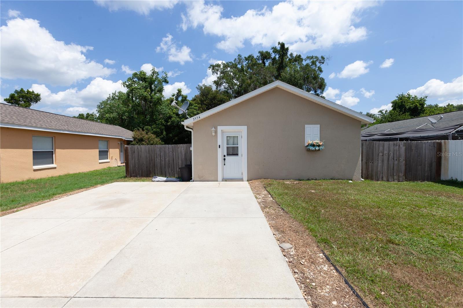 Welcome to this charming 2-bedroom, 2-bath residence offering 1,218 square feet of comfortable living space in a convenient Wildwood location. Recent updates provide peace of mind, including a new HVAC system installed in 2022.  Ideally situated just off US-301, this property offers easy access to The Villages, shopping, dining, entertainment, medical facilities, and everyday conveniences. Whether you’re looking for a primary residence, seasonal retreat, or investment opportunity, this home combines comfort, value, and a prime location. Schedule your private showing today!