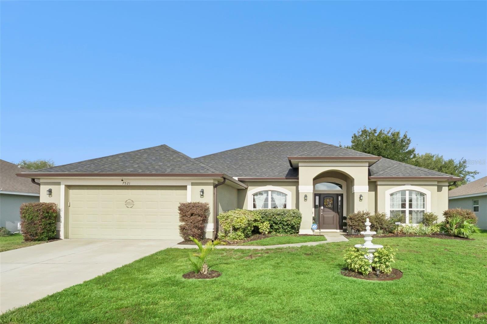 Welcome home to a peaceful country lifestyle in the desirable Park Hill community of Leesburg! Built in 2019 and METICULOUSLY MAINTAINED, this stunning MOVE-IN READY 4 bedroom, 2 bath, 2 car garage residence offers over 2,330 heated square feet (2,750 total sq. ft.) of beautifully designed living space with NO REAR NEIGHBORS. Step inside to discover an open and airy floor plan featuring elegant architectural details, 5¼” baseboards, arched interior doorways and an abundance of natural light throughout. Designed with both entertaining and everyday living in mind. THIS HOME OFFERS A FORMAL LIVING AND DINING SPACE PLUS A LARGE FAMILY ROOM perfect for gathering with family and friends. The heart of the home is the beautifully appointed kitchen featuring upgraded stainless appliances, 36” upper cabinets with CROWN MOLDING, breakfast bar seating, abundant counter space, recessed lighting, and a cozy breakfast nook overlooking the screened patio and peaceful backyard. Enjoy morning coffee or evening sunsets from your private screened lanai with no rear neighbors, the perfect place to relax and unwind while enjoying Florida’s beautiful weather. The SPACIOUS OWNER'S SUITE is a true retreat with dual walk-in closets and a luxurious ensuite bath featuring raised double vanities, a relaxing GARDEN TUB AND SEPARATE GLASS ENCLOSED SHOWER. Bedroom 4 offers flexibility as a home office, den or guest room. Additional highlights include an oversized interior laundry room, energy efficient construction, insulated Low E windows, concrete block construction, irrigation system, architectural shingles and smart design features throughout. This community is tucked away from the hustle and bustle, you’ll enjoy the best of small-town living with nearby lakes, boating, fishing, parks and easy access to The Villages, Mount Dora and Orlando attractions. VERY LOW HOA fee and NO CDD. If you're searching for a beautifully cared for home with LOTS OF SPACE, privacy and MODERN UPGRADES in a peaceful neighborhood setting, this is the one you’ve been waiting for! Schedule your showing today!