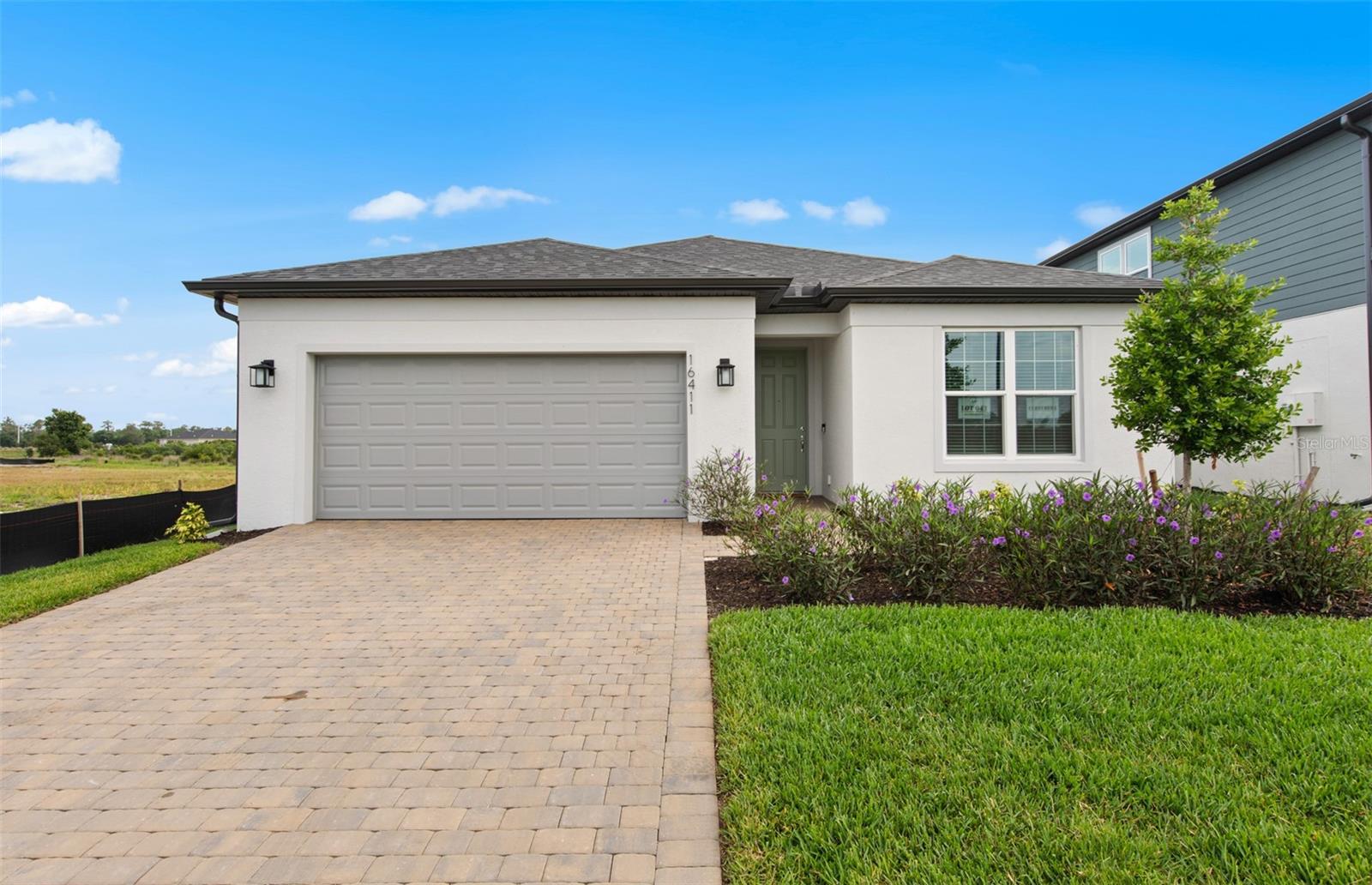 Welcome to the Crestmere, this home features an owner's suite with a spacious walk-in closet, room to grow, and extra space - perfect for your expanding family or empty nesters. This home has plenty of storage in with the four-foot garage extension. The Move in Ready package was selected to include all appliances (washer, dryer, and fridge) and window blinds. Reagan Landing, located in Bradenton, FL, has something for everyone. Here you can live in your dream nearby world-class golf courses, pristine beaches, dining, and shopping. There are always activities within reach, either offsite or at the private community amenity center.