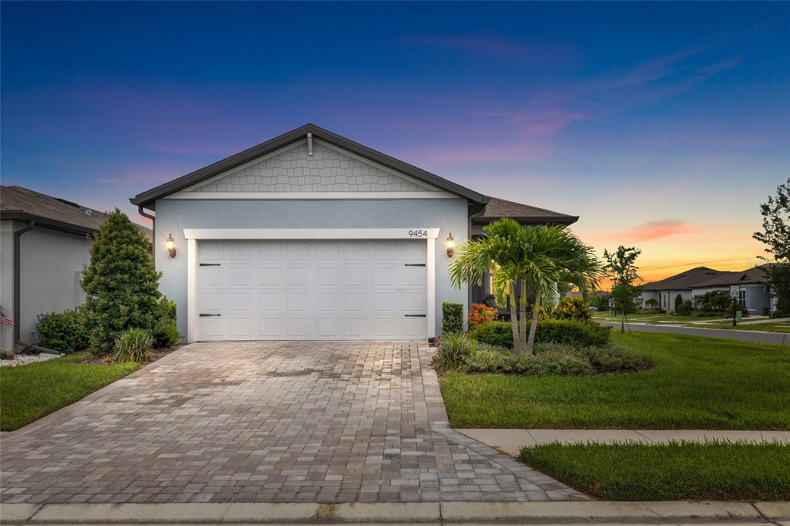 Virtually Staged. Welcome to easy Florida living in the highly sought-after Del Webb BayView active adult community! This beautifully maintained, nearly new Contour floor plan sits on a desirable corner homesite and is truly move-in ready.

From the moment you arrive, you'll appreciate the charming screened front porch—perfect for enjoying your morning coffee, greeting neighbors, or relaxing in the evening breeze. Inside, the thoughtfully designed open-concept layout offers comfortable everyday living and effortless entertaining.

The gourmet kitchen is a standout feature, showcasing a large center island, quartz countertops, gray cabinetry, pantry, stainless steel appliances, built-in oven and microwave, gas cooktop, and designer wood canopy hood. The spacious gathering room flows seamlessly to the screened rear lanai, creating the perfect indoor-outdoor living experience.

The owner's suite offers a private retreat with dual vanities, quartz countertops, a walk-in shower with bench seating, and a generous walk-in closet. A versatile flex room provides the ideal space for a home office, hobby room, den, or additional guest accommodations.

Additional upgrades include luxury vinyl plank flooring throughout the main living areas, tile flooring in the bathrooms and laundry room, Smart Home technology, pendant lighting pre-wire, and flat-panel TV preparation.

Located within Del Webb BayView, residents enjoy resort-style amenities, restaurant with social clubs, fitness facilities, pickleball, pools, and an active lifestyle just minutes from Sarasota, St. Petersburg, and Tampa.  And so many more local stores and restaurants are going in monthly!

Why wait to build when you can move right into this exceptional home and start enjoying the Del Webb lifestyle today?