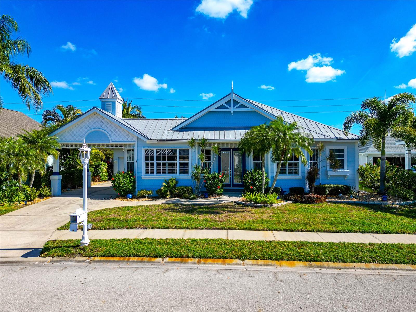 Are you looking for a coastal chic atmosphere well look no further...... Welcome to this delightful Key West style home in the boating community of the Inlets at Riverdale where elegance meet convenience with easy access to the Mantee River and Gulf, a Marina with both rental and sale of boat slips only being a few blocks away. (Currently Slip #1 is rented thru December at the marina) No CDD's and extremely low HOA's and taxes make this a savvy decision. From the moment you drive in you will be greeted by an entrance lined with exquisite and picturesque landscaping taking you to a place of peace and relaxation. Walking thru the double doors will be a breath of fresh air as you will immediately feel the beachy vibes of this completely updated 3/4 bedroom open split floor plan home. The kitchen which is the heart of this home is centrally located with a breakfast bar for entertaining your friends and family. The primary suite has his and her walk ins, and a spa like bath for your personal retreat. The interior is accentuated with crown molding, new blinds and plantation shutters that will bring the Florida sunshine in when you want and then close the world away when you are ready. The home has been recently painted inside and out with new hurricane doors and shutters for the windows serving as your safe haven.  New kitchen appliances, washer and dryer, water heater, A/C, pool filter and heater for your saltwater lounging pool are just a few of the updates that have been recently done. Step out onto your All-new lanai with Clear View Screens and brick pavers for your own piece of paradise with complete privacy (extensive landscaping) for enjoying all that the Florida weather offers. Large, covered area for those that prefer the shade along with plenty of room for the sun goddess in you. A new outdoor kitchen has just been added making your cherished occasions more effortless.  With the community offering so many water amenities you can find something to do every day. Restaurants, entertainment and medical all in close proximity.  Put this on your to do list today!!!!!