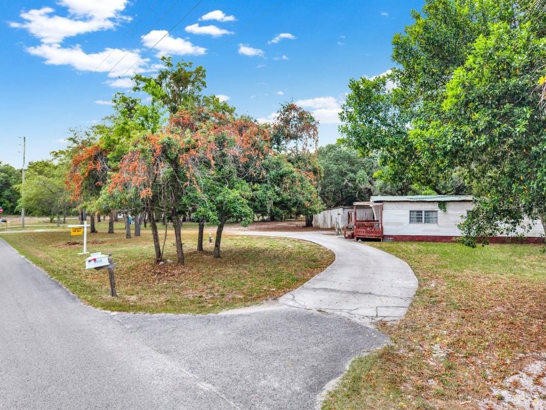 Exceptional opportunity to own nearly an acre (.90 acres) of land with no HOA, no lot rent, and located outside of a flood zone. The true value is in the land and existing impact fees, offering incredible potential for future development—including the possibility to split this spacious double lot (buyer to verify).
With an expansive driveway and generous lot size, this property is ideal for building your custom dream home while still enjoying privacy and flexibility. Conveniently located near US-19 and Little Road, providing easy access to New Port Richey, Tarpon Springs, Dunedin, and Clearwater—making commuting, shopping, dining, and beaches all within reach.
Septic and well inspection reports are available upon request.