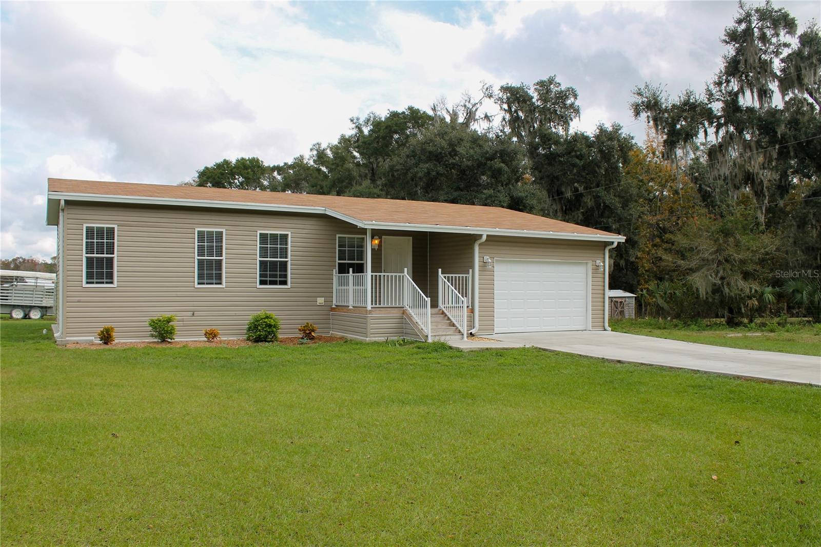 2 bedroom, 2 bath home is now available! This cozy home sits across the street from Cedarkirk Lodge in Lithia. Beautiful trees to enjoy while you sit on your covered front porch. Maintained fields sit directly behind the home, making morning sunrises a sight to see. This 2 year old home is well kept and ready for move in. An open living room is connected to the eat in kitchen. Washer & dryer hook ups are conveniently located just off the kitchen, with a door to access the back yard. The master bedroom is complete with its private bathroom and walk in closet. The second bedroom, across the home is next to the homes second bathroom. A single car garage sits off the living room, with extra storage space and an automatic door. Call today to come check it out!